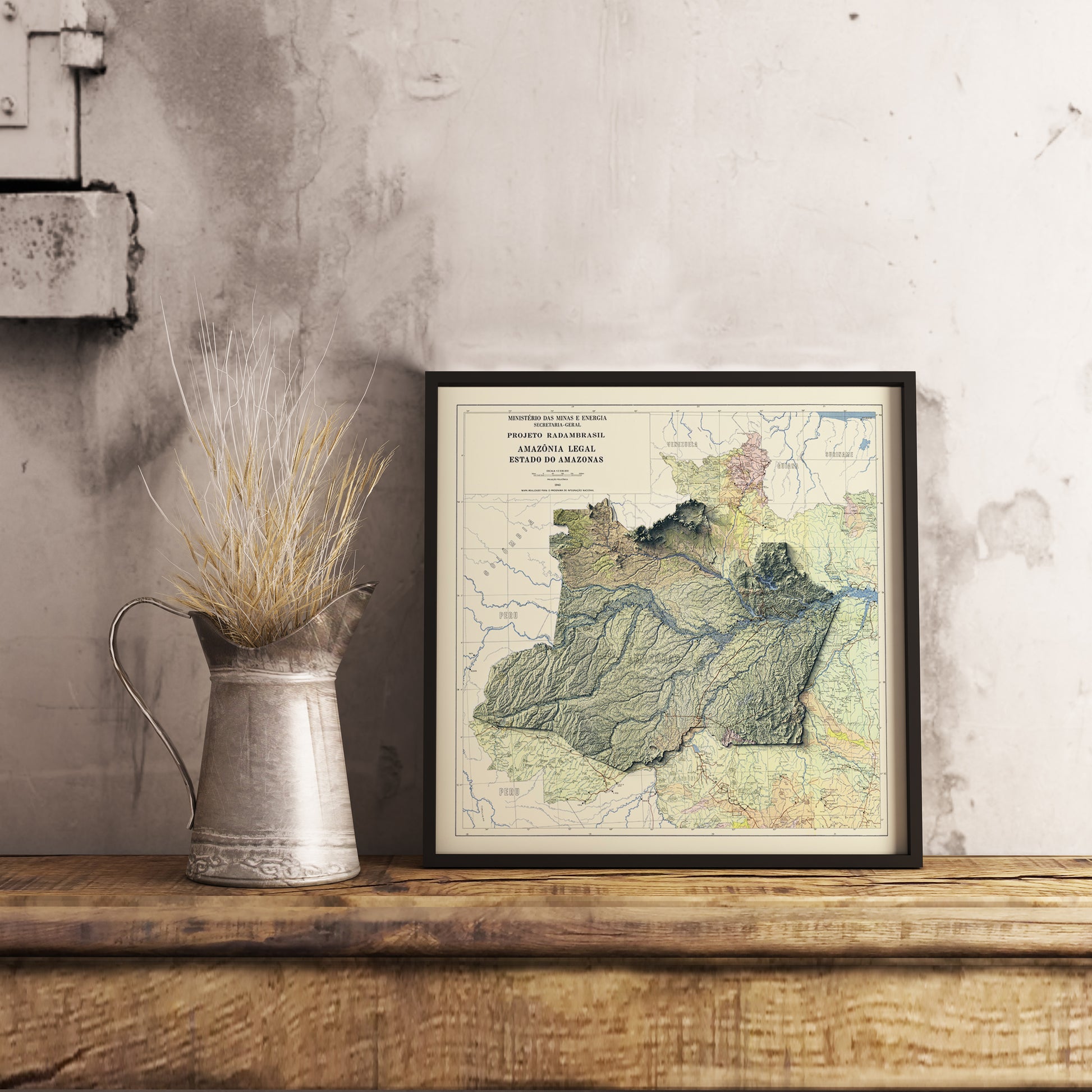 Vintage Amazonas State (Brazil) shaded relief map in black frame. Realistic terrain art print for home decor, displayed on rustic wooden table