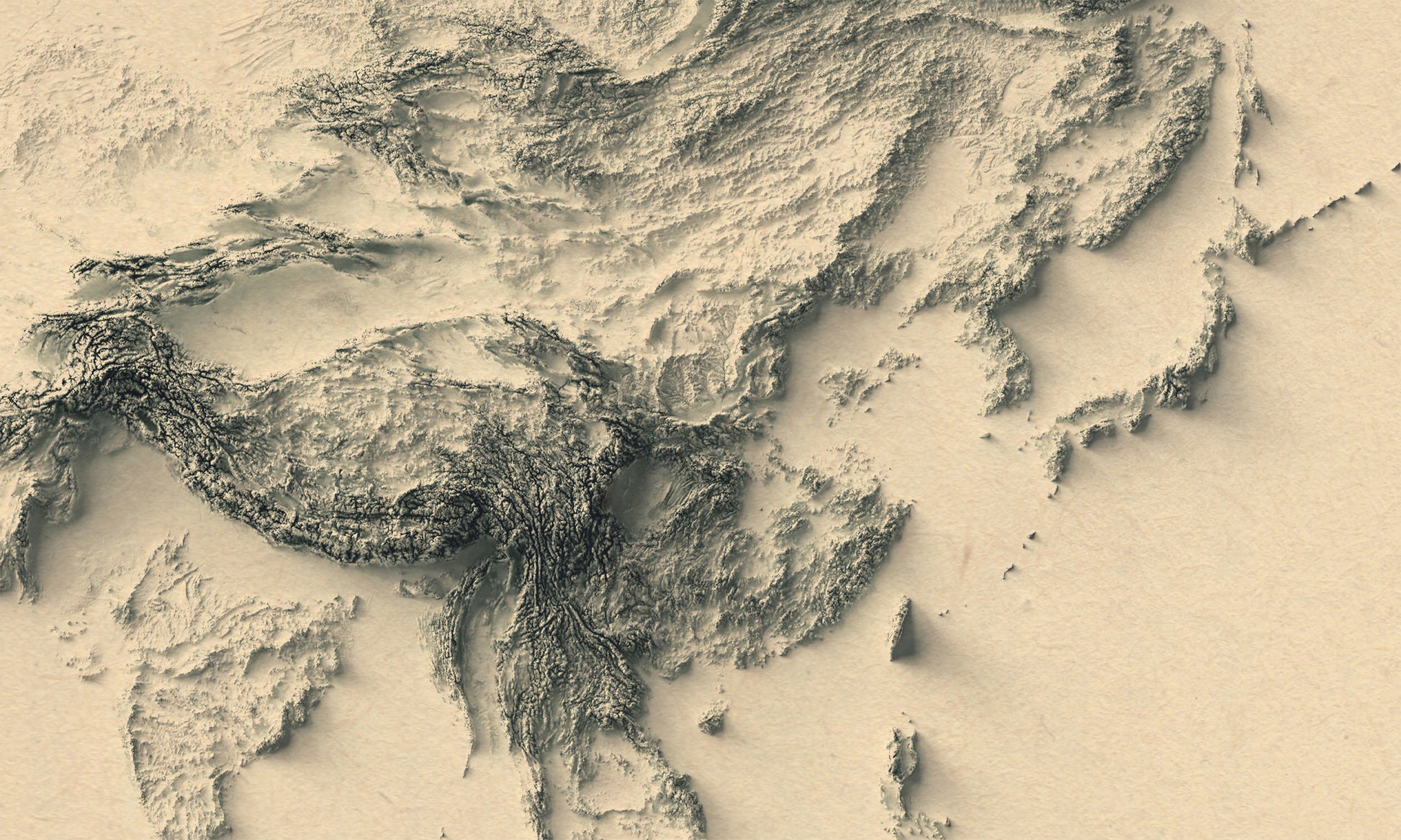 Detailed close-up of a vintage Asia relief map, showcasing textured topography and geographic contours