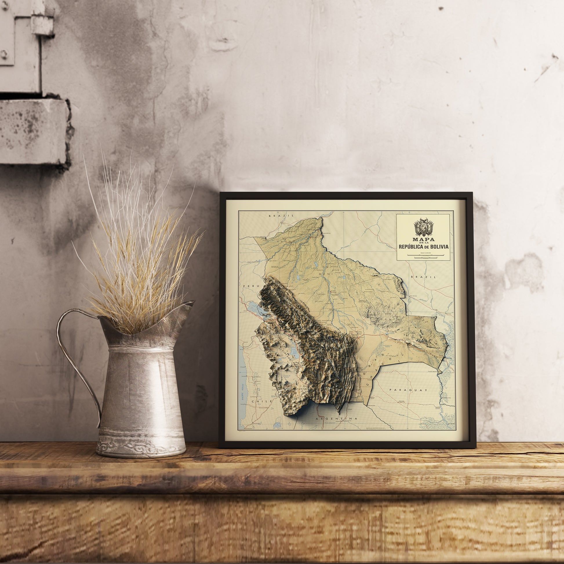 Vintage Bolivia shaded relief map in black frame. Realistic terrain art print for home decor, displayed on rustic wooden table