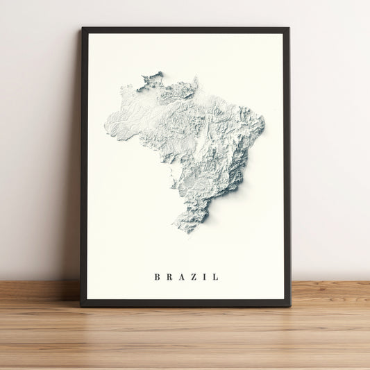 Brazil shaded relief map in black frame. Realistic terrain art print for home decor, displayed on rustic wooden table