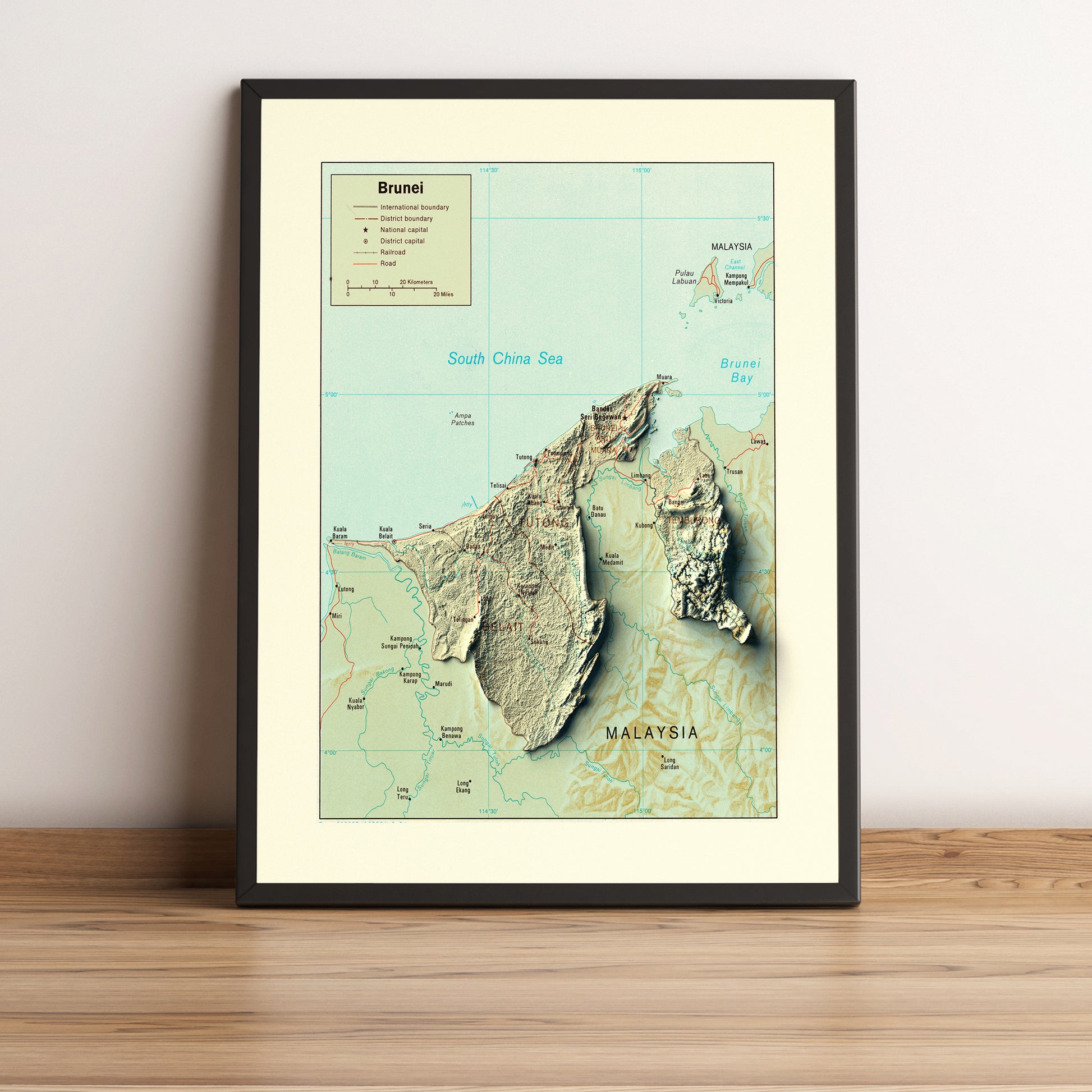 Brunei vintage framed shaded relief map in black frame. Artistic print highlighting mountains with a realistic terrain effect