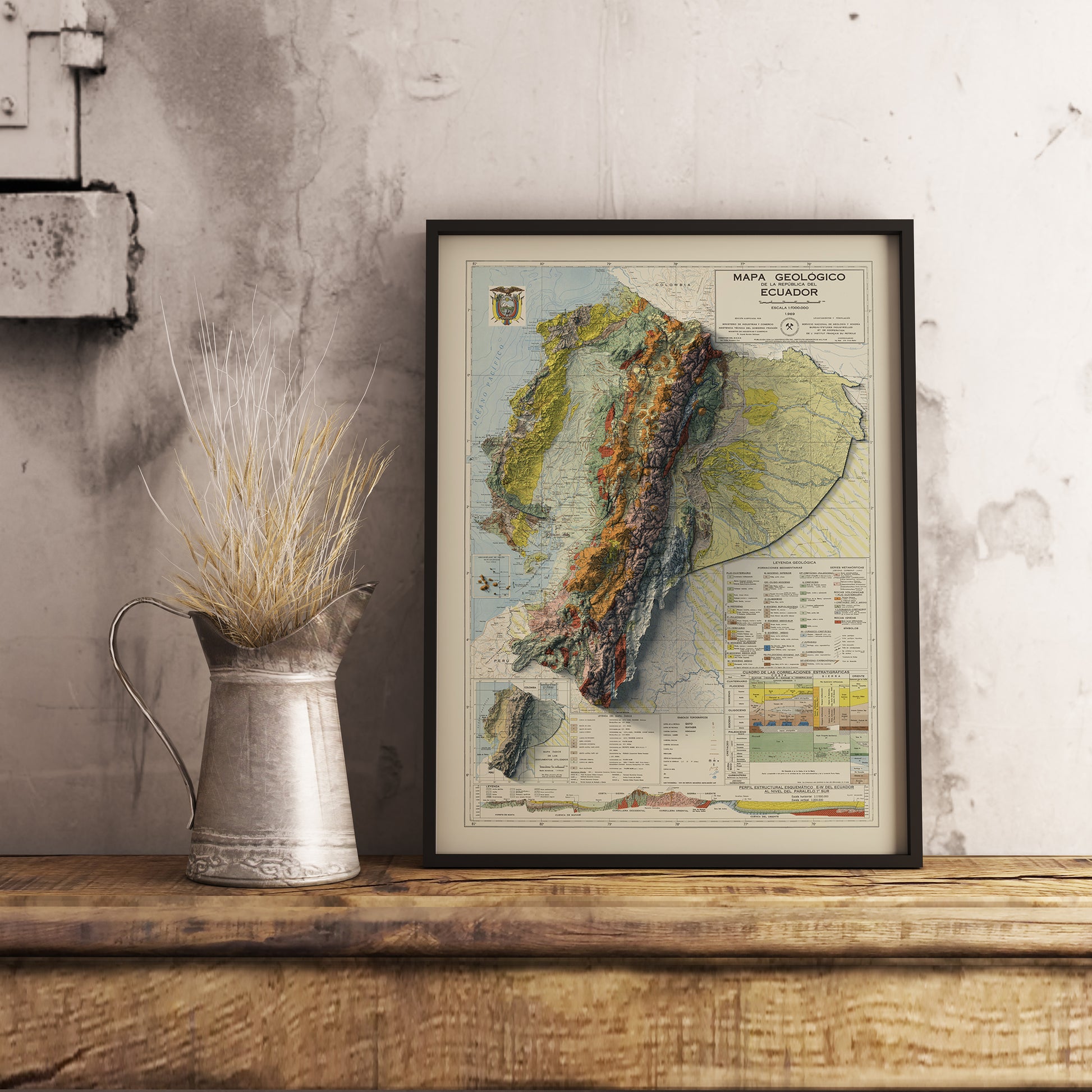 Vintage Ecuador shaded relief map in black frame. Realistic terrain art print for home decor, displayed on rustic wooden table