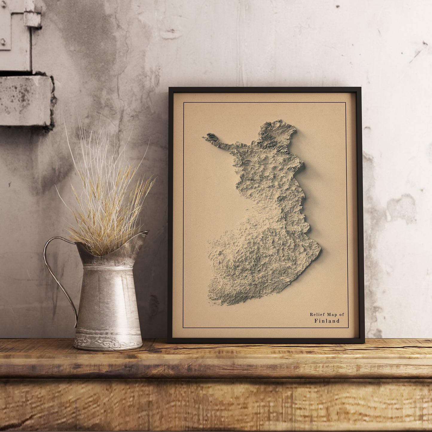 Vintage Finland shaded relief map in black frame. Realistic terrain art print for home decor, displayed on rustic wooden table