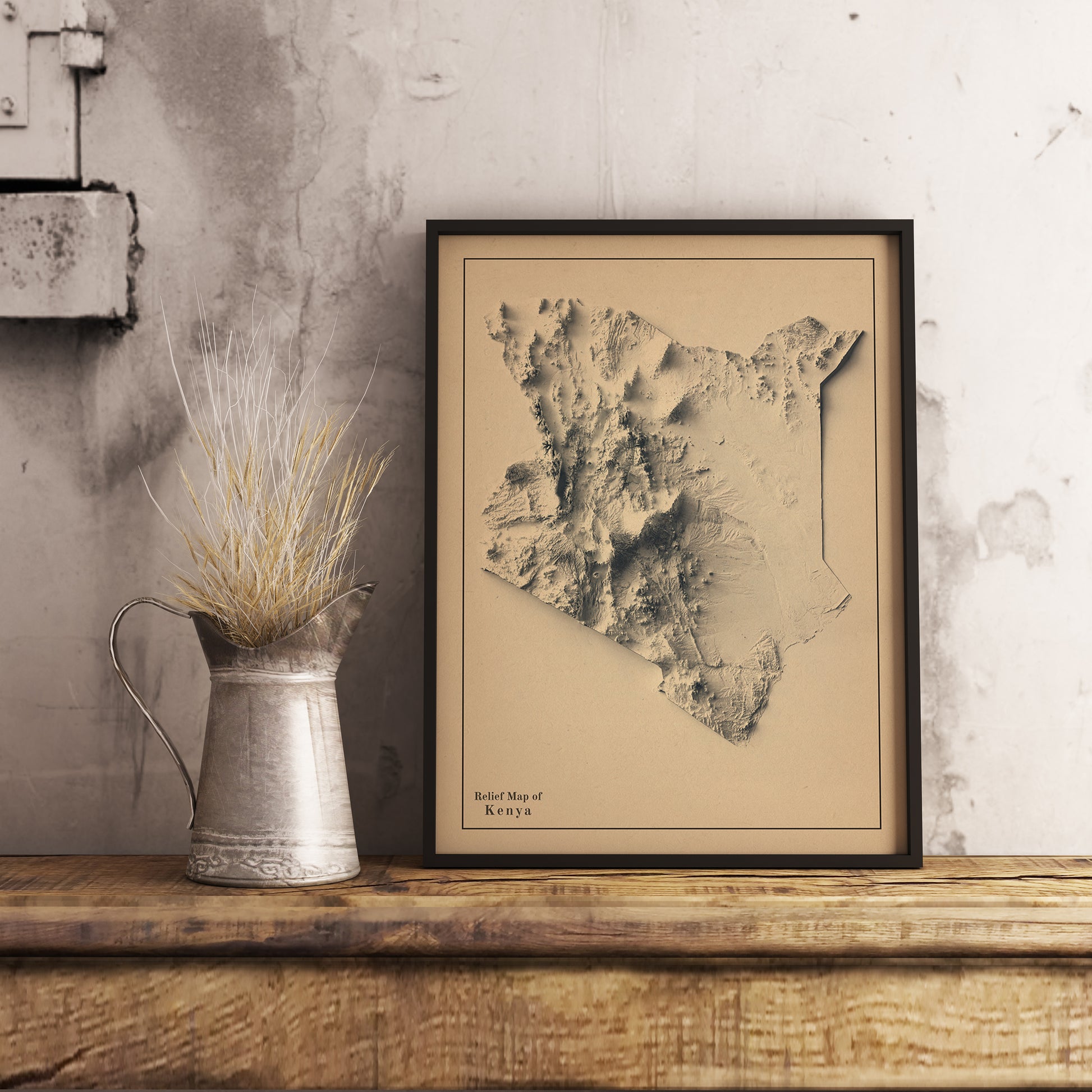 Kenya shaded relief map in black frame. Realistic terrain art print for home decor, displayed on rustic wooden table