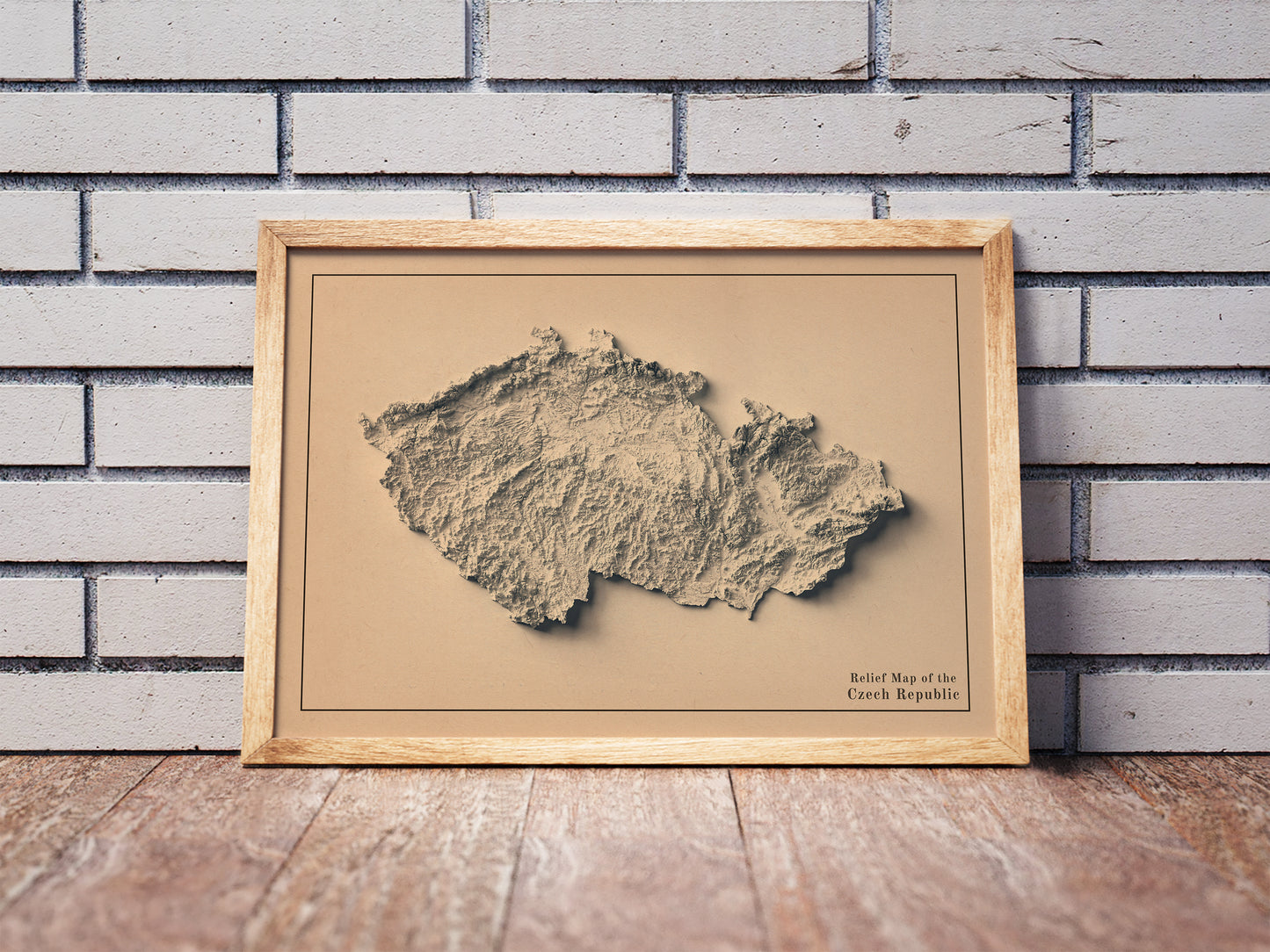 Vintage Czech Republic shaded relief map in a wooden frame. Realistic terrain art print for home decor, displayed against a brick wall