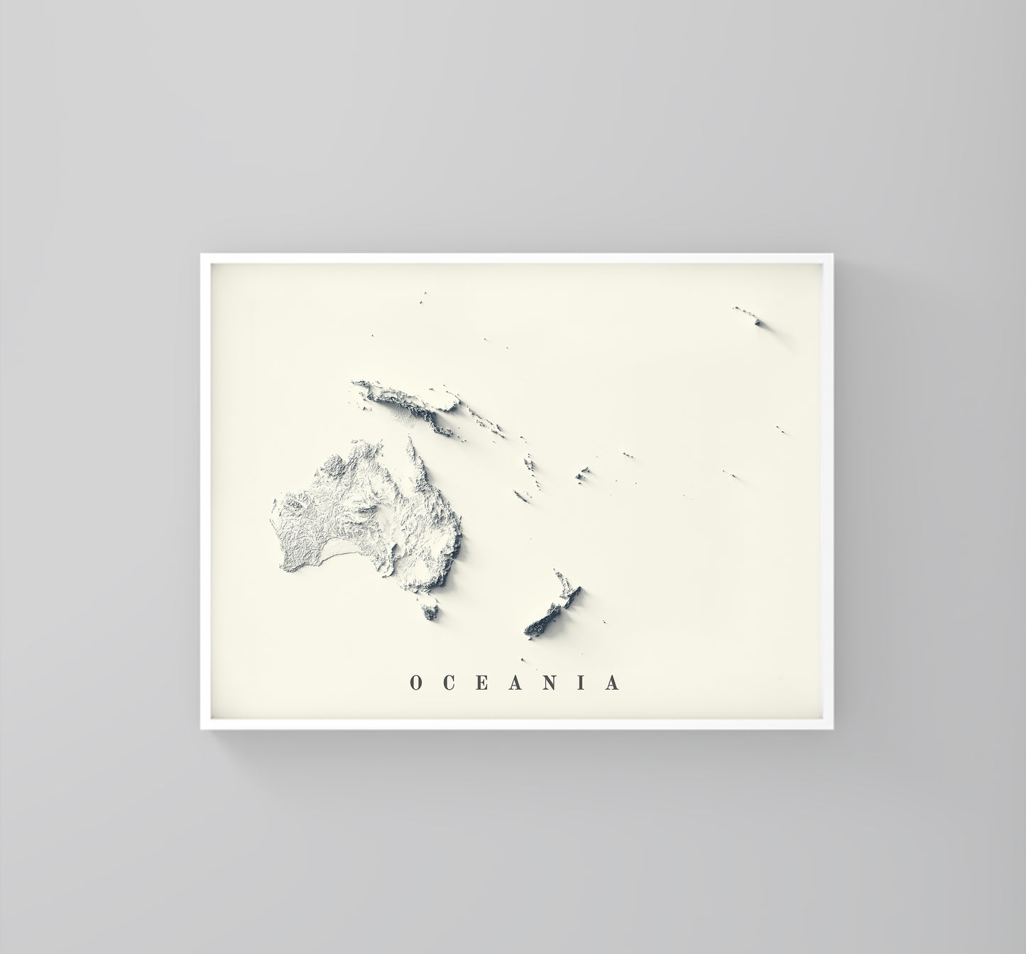 Oceania vintage framed shaded relief map in white frame. Artistic print highlighting mountains with a realistic 3d effect