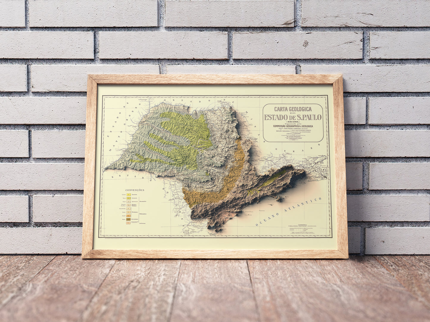Vintage Sao Paulo (Brazil) shaded relief map in a wooden frame. Realistic terrain art print for home decor, displayed against a brick wall