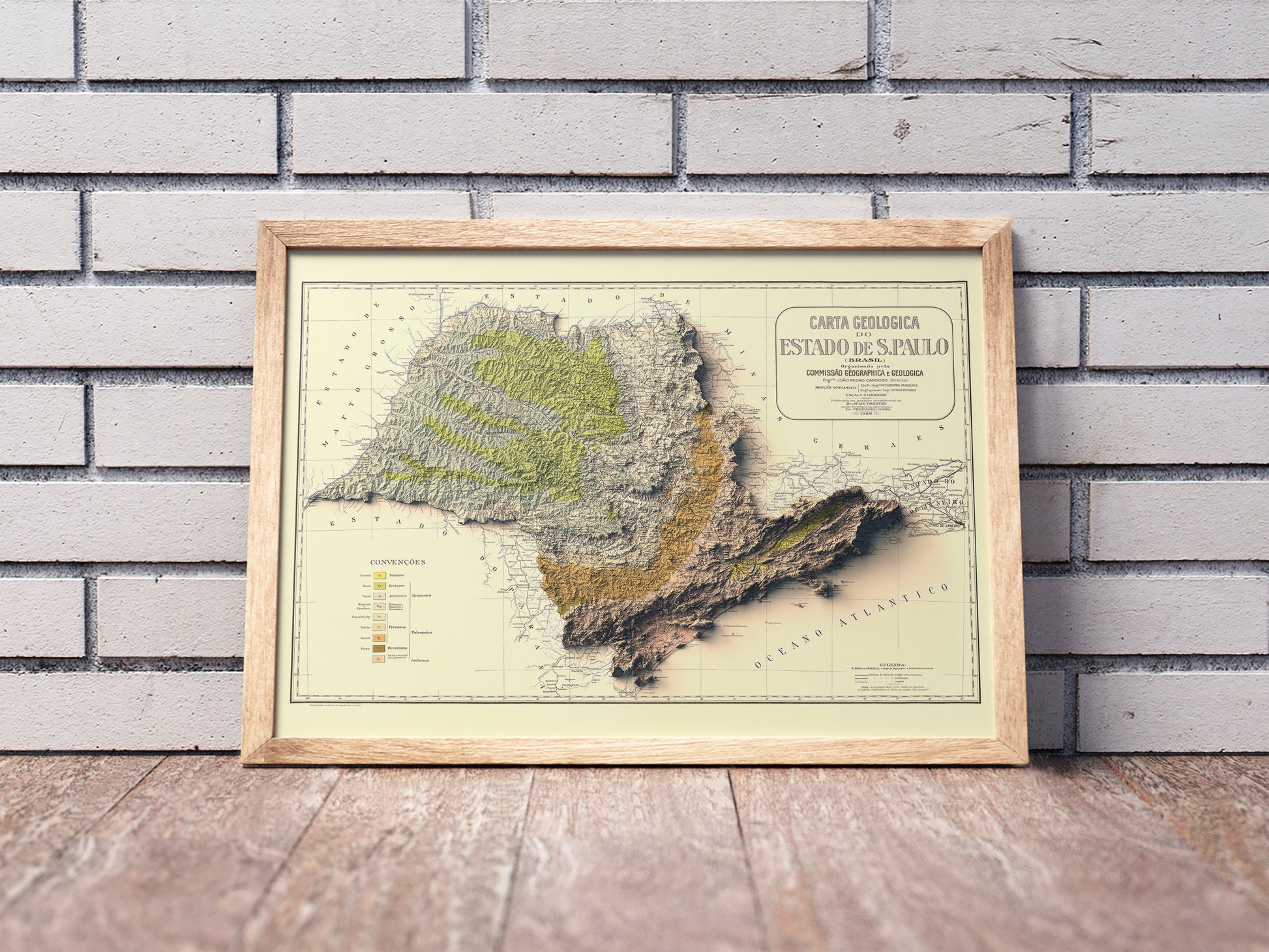 Vintage Sao Paulo (Brazil) shaded relief map in a wooden frame. Realistic terrain art print for home decor, displayed against a brick wall