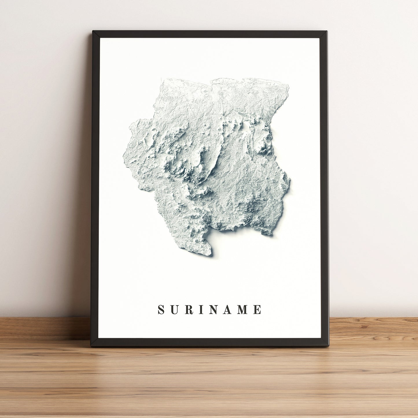 Suriname framed shaded relief map in black frame. Artistic print highlighting mountains with a realistic terrain effect