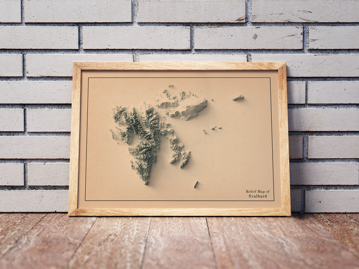 Vintage Svalbard, Norway, shaded relief map in a wooden frame. Realistic terrain art print for home decor, displayed against a brick wall