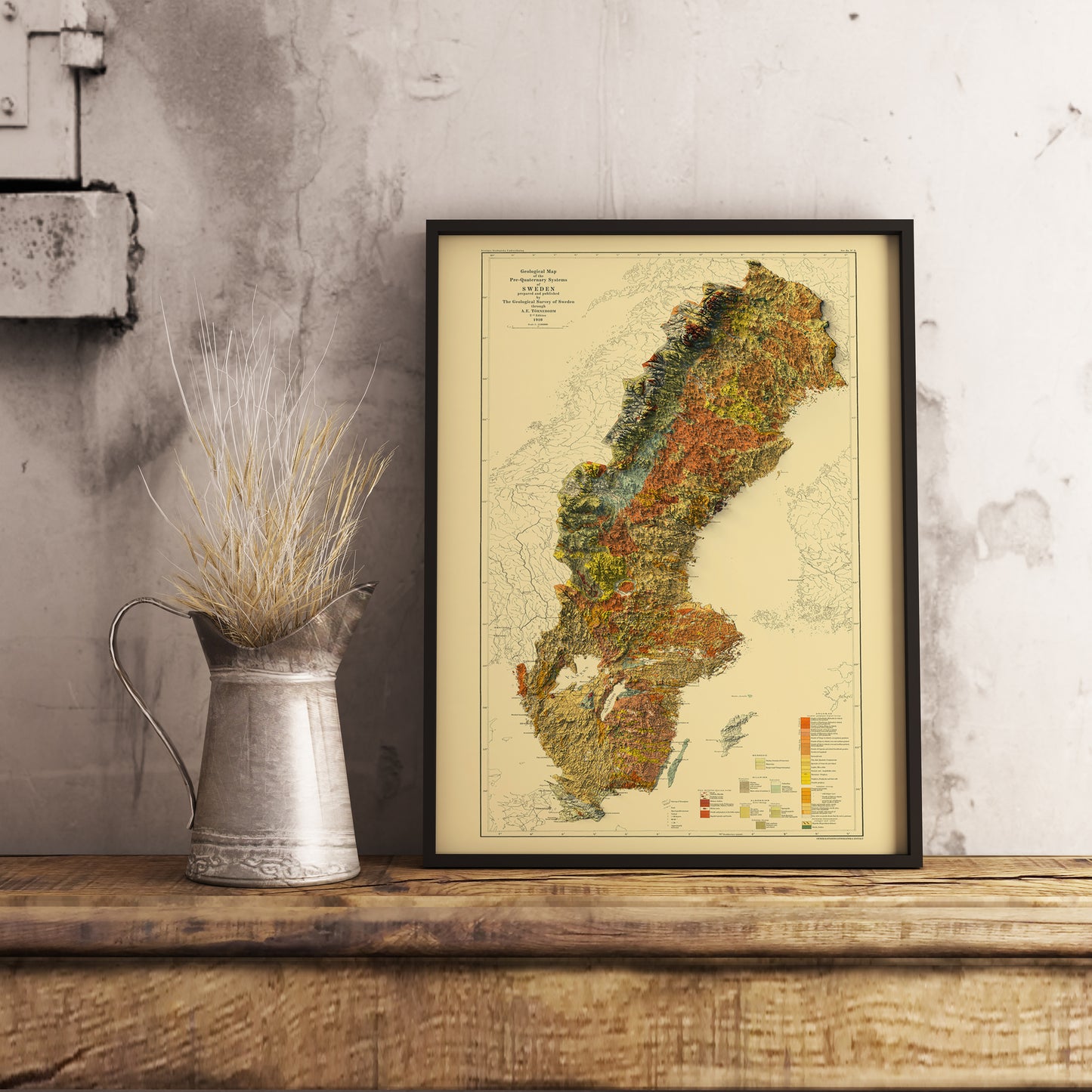 Vintage Sweden shaded relief map in black frame. Realistic terrain art print for home decor, displayed on rustic wooden table