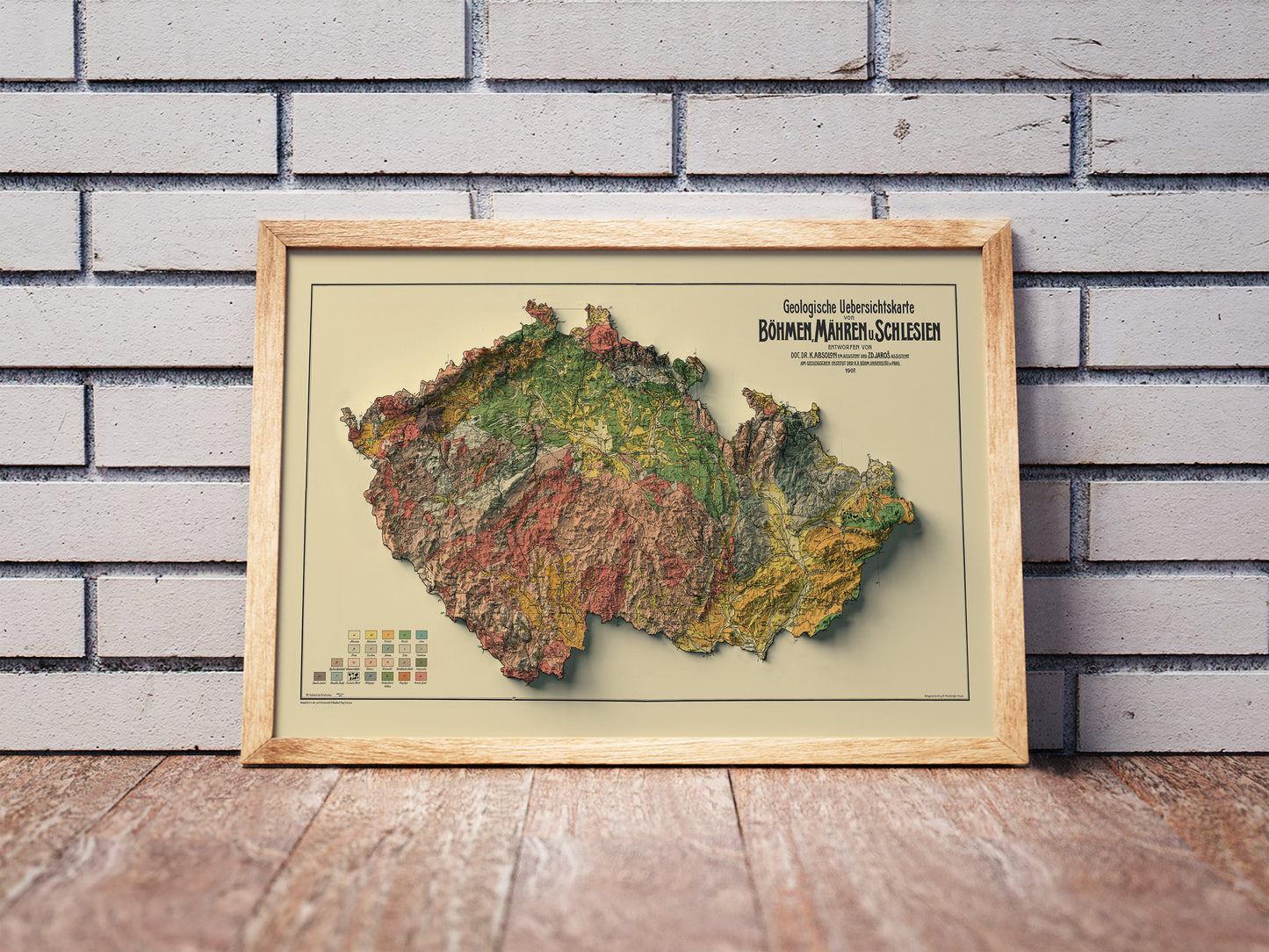 Vintage Czech Republic shaded relief map in a wooden frame. Realistic terrain art print for home decor, displayed against a brick wall