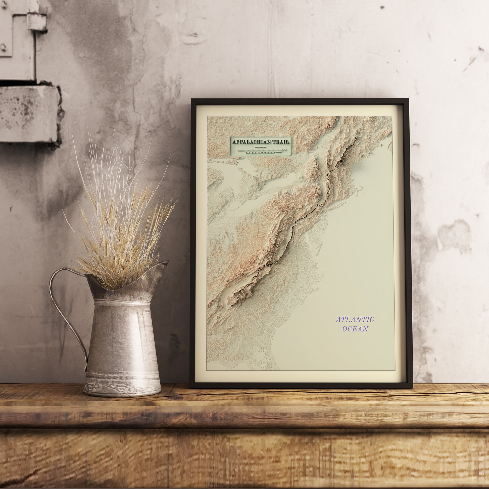 Vintage Appalachian Trail shaded relief map in black frame. Realistic terrain art print for home decor, displayed on rustic wooden table