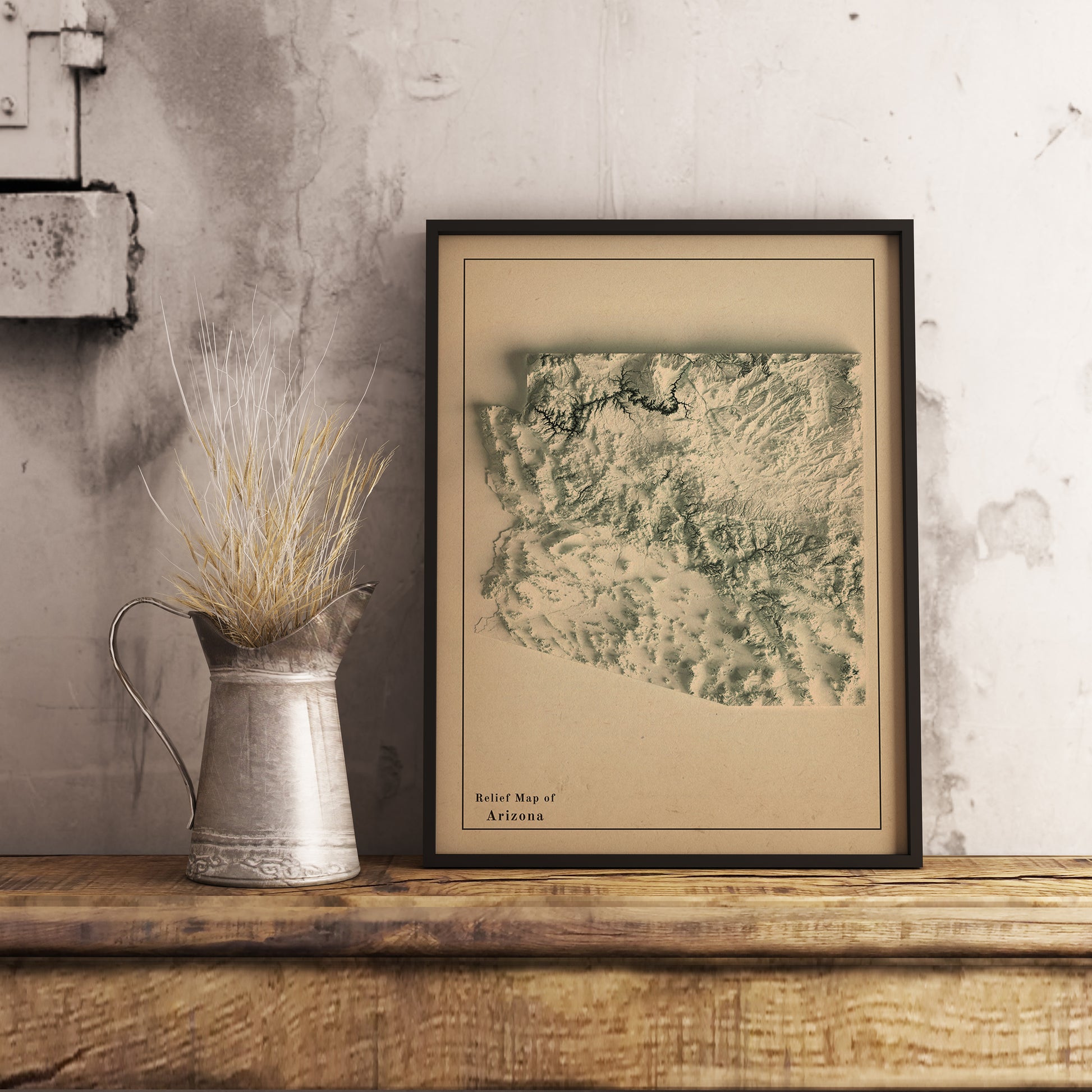 Vintage Arizona (USA) shaded relief map in black frame. Realistic terrain art print for home decor, displayed on rustic wooden table