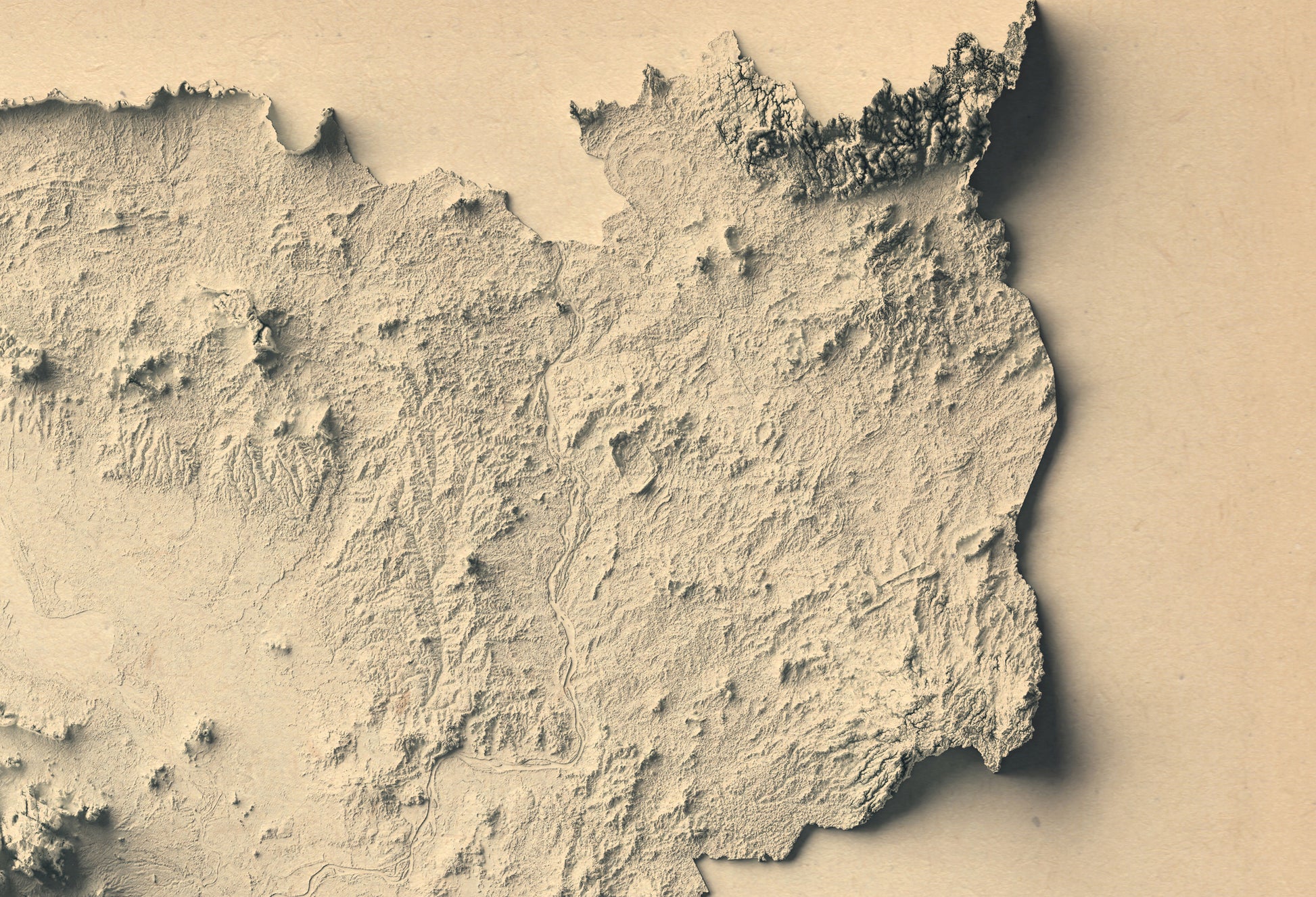Detailed close-up of a Cambodia relief map, showcasing textured topography and geographic contours