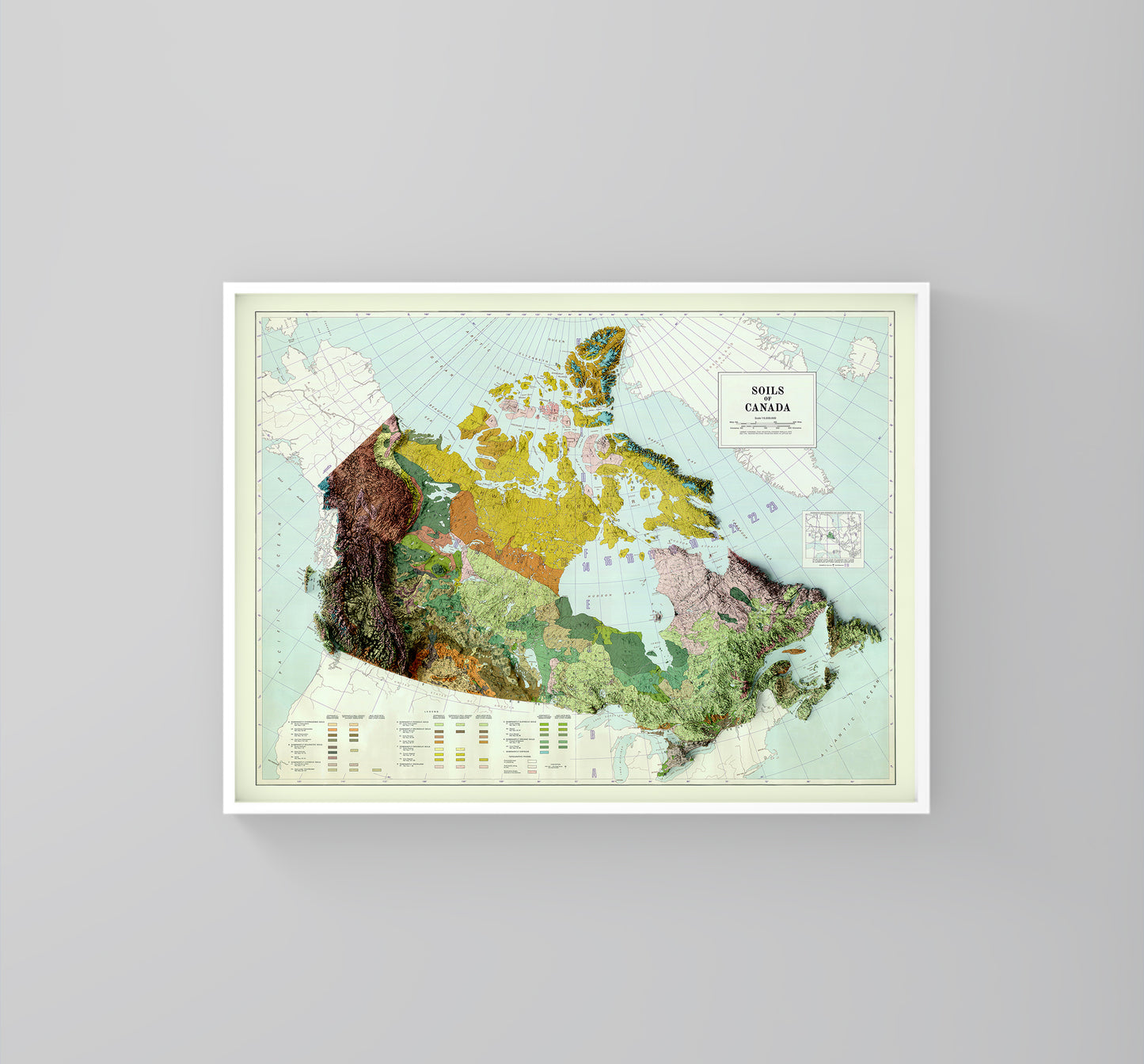 Canada vintage framed shaded relief map in white frame. Artistic print highlighting mountains with a realistic 3d effect