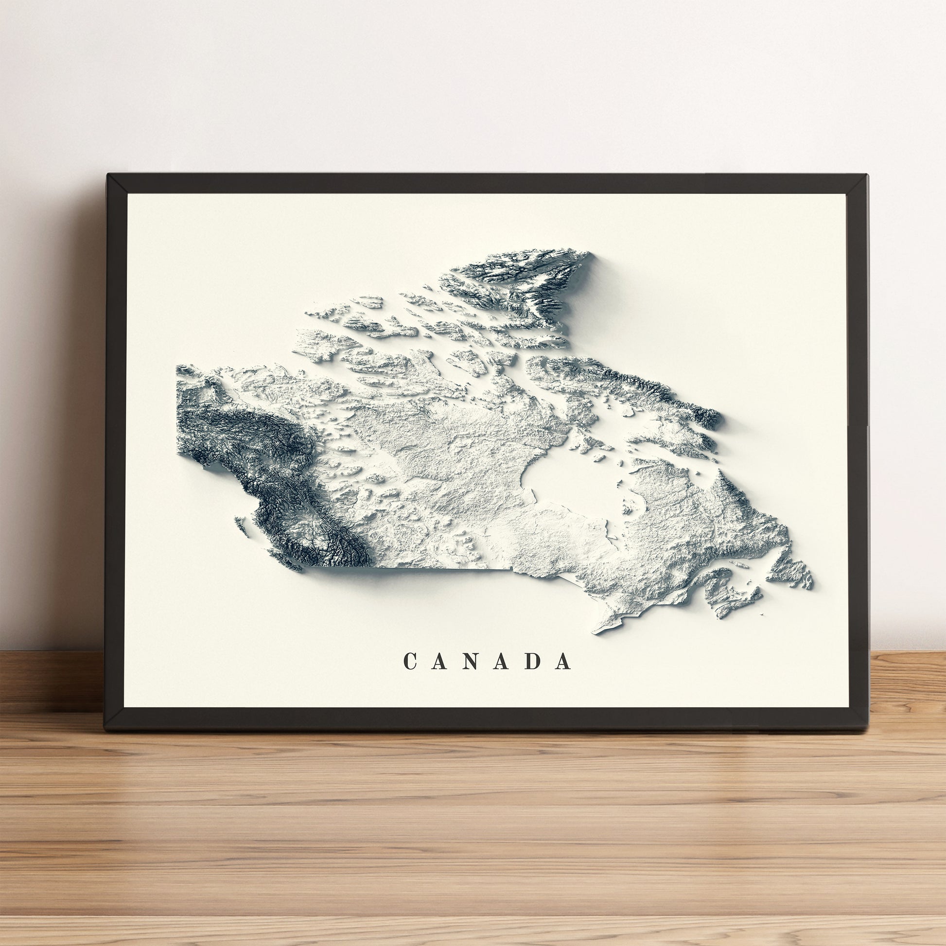 Canada vintage framed shaded relief map in black frame. Artistic print highlighting mountains with a realistic terrain effect
