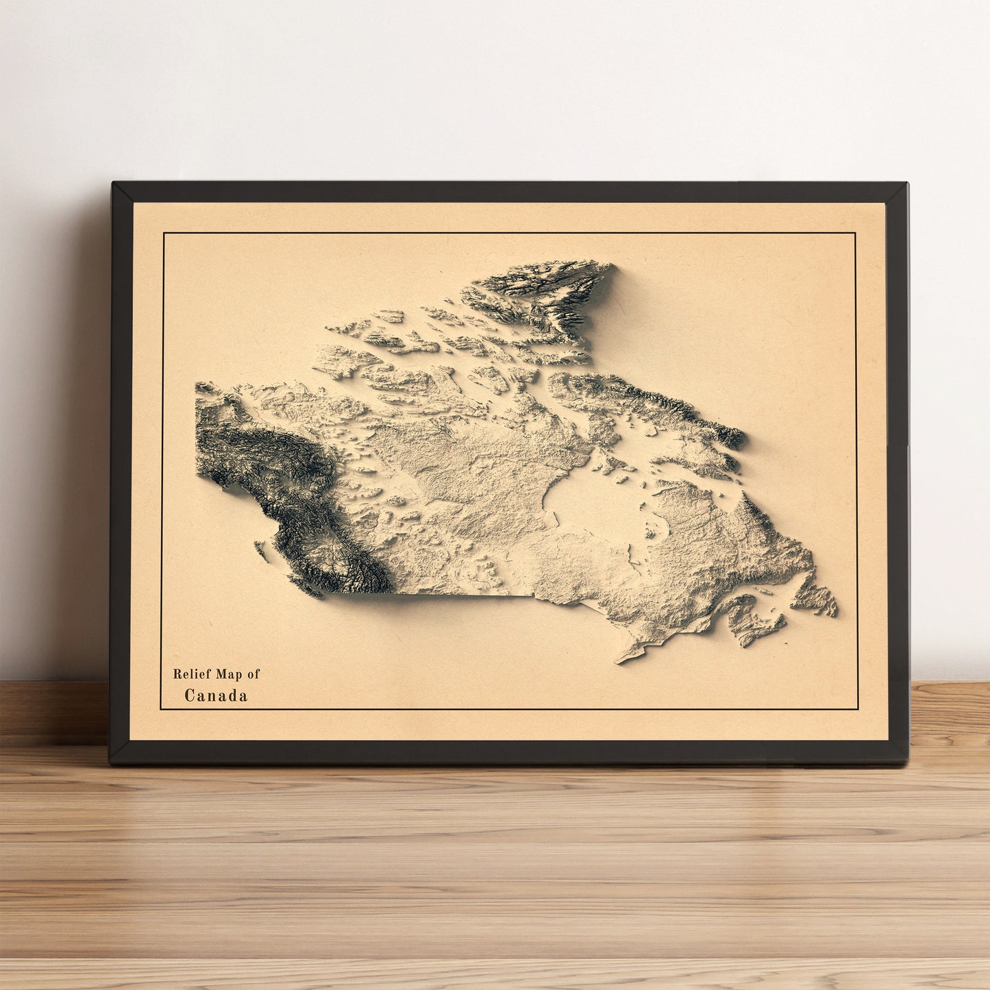 Canada vintage framed shaded relief map in black frame. Artistic print highlighting mountains with a realistic terrain effect