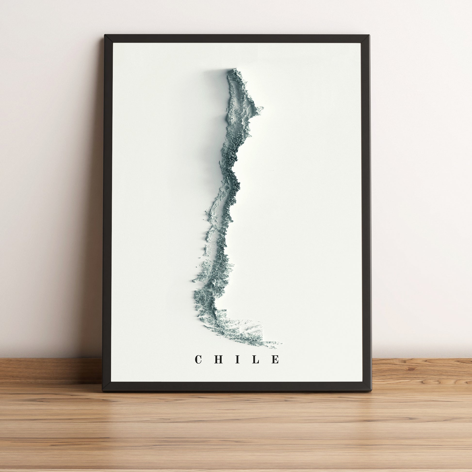 Chile framed shaded relief map in black frame. Artistic print highlighting mountains with a realistic terrain effect