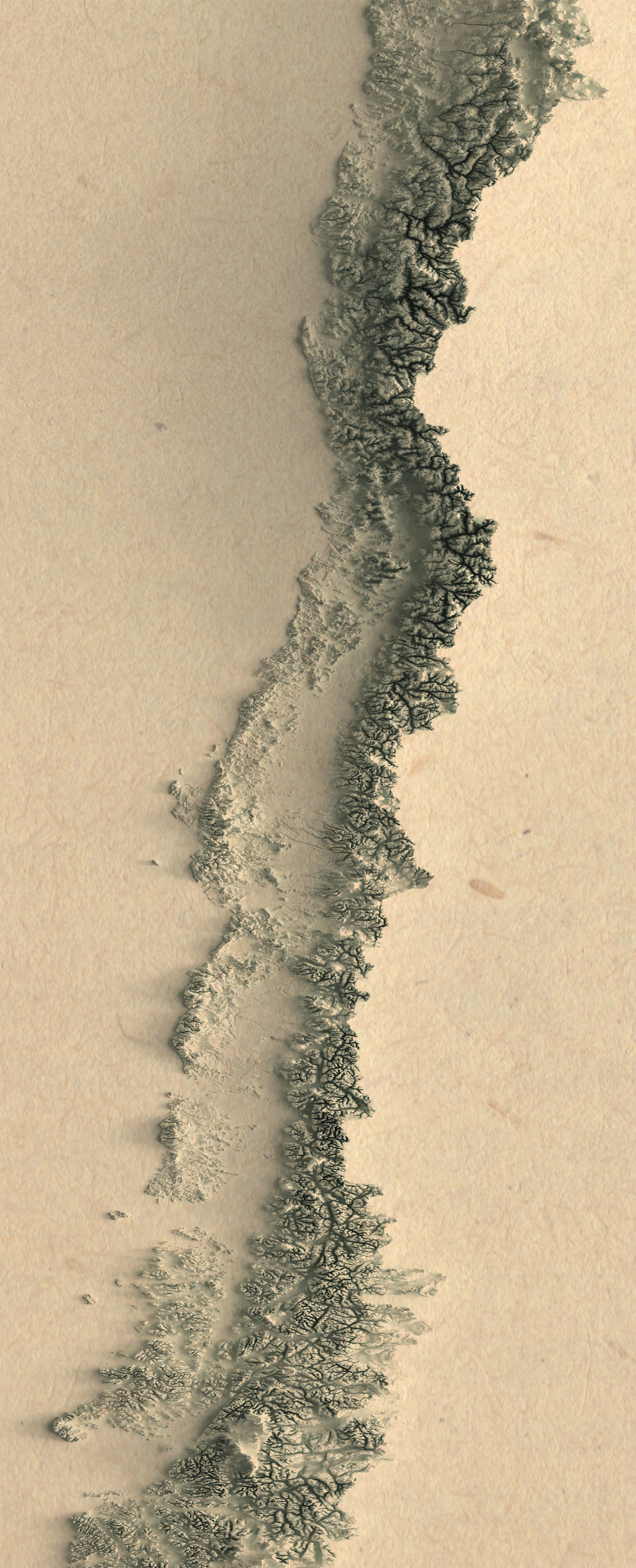 Detailed close-up of a Chile relief map, showcasing textured topography and geographic contours
