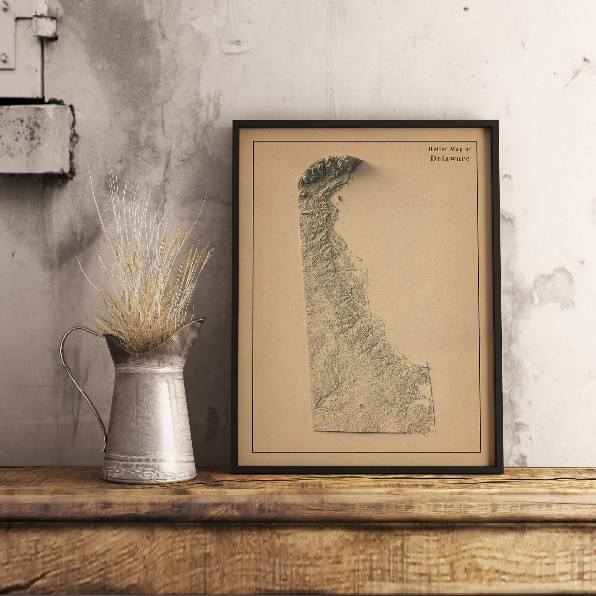 Vintage Delaware (USA) shaded relief map in black frame. Realistic terrain art print for home decor, displayed on rustic wooden table