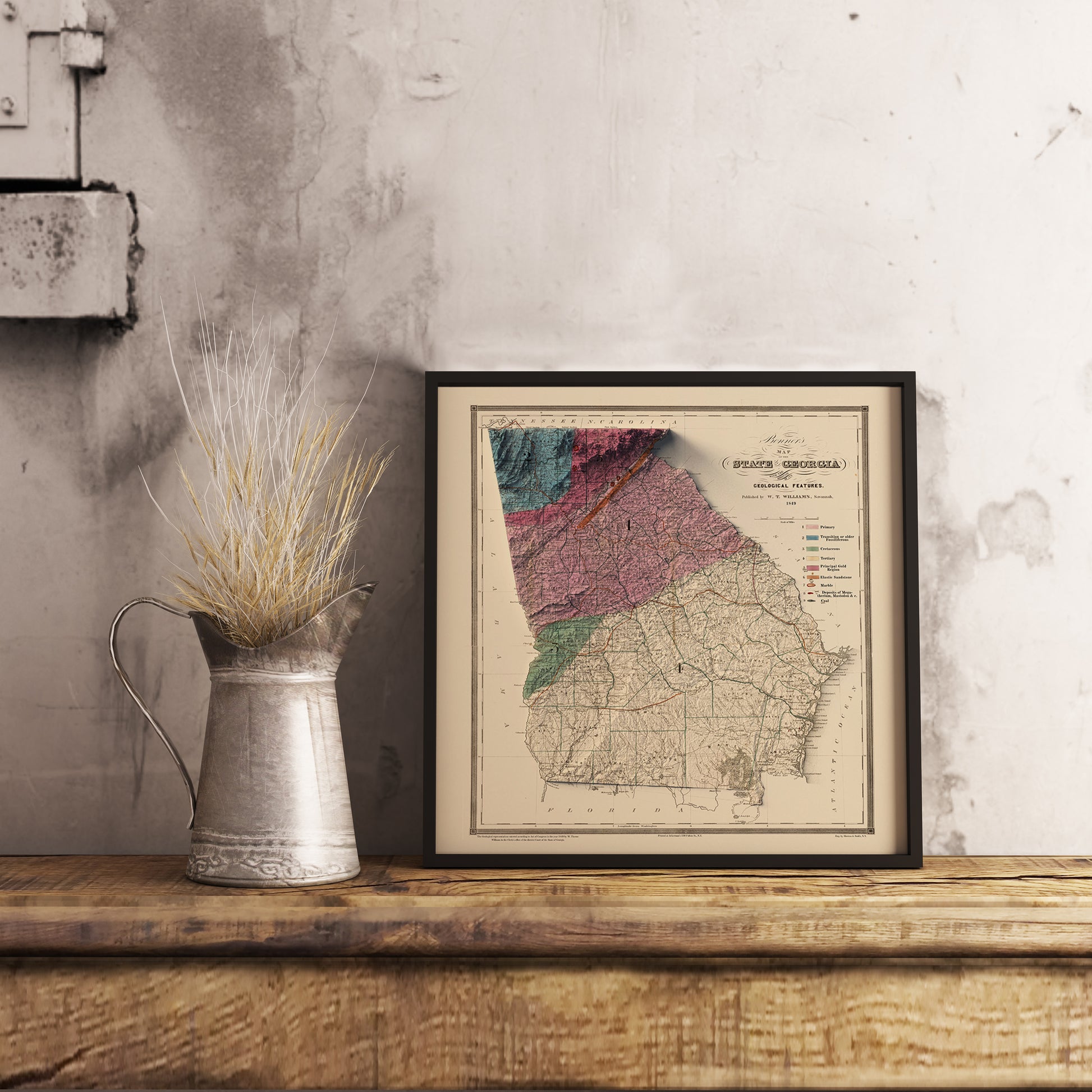 Vintage Georgia (USA) shaded relief map in black frame. Realistic terrain art print for home decor, displayed on rustic wooden table