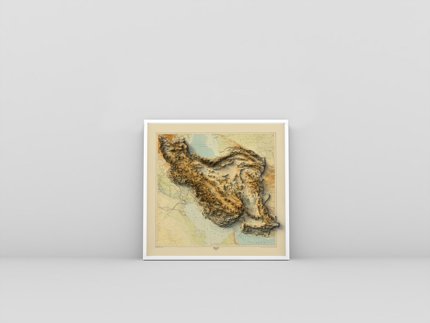 Iran vintage framed shaded relief map in white frame. Artistic print highlighting mountains with a realistic 3d effect