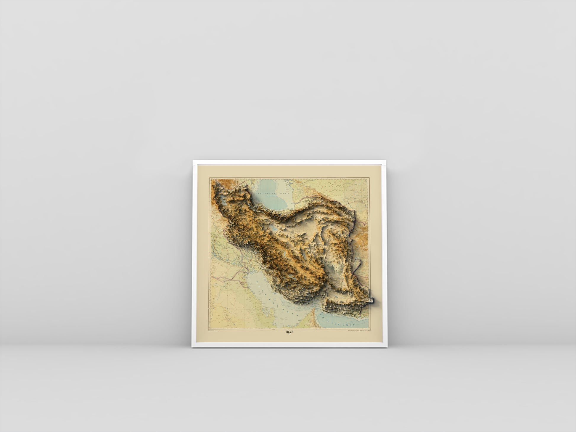 Iran vintage framed shaded relief map in white frame. Artistic print highlighting mountains with a realistic 3d effect