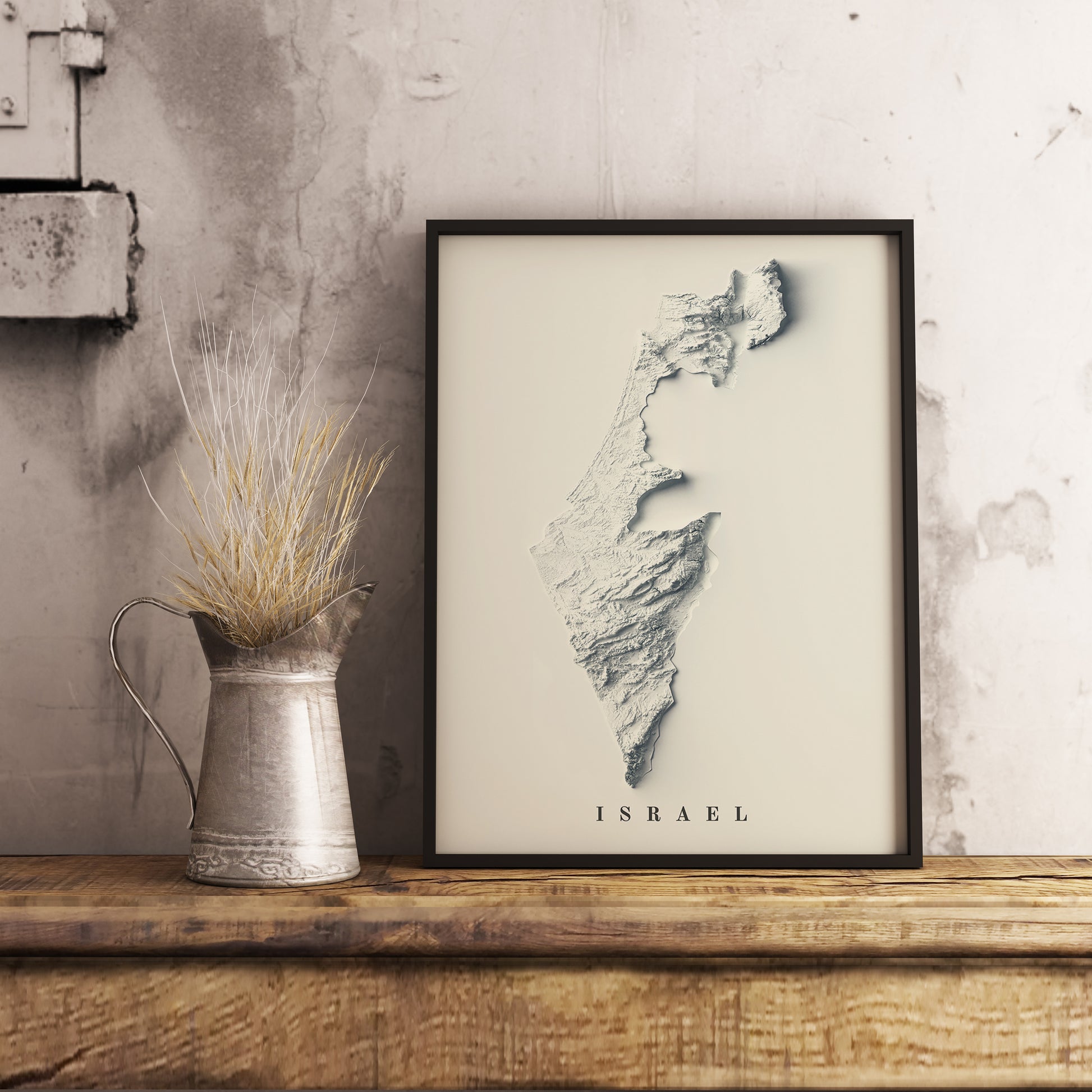 Israel shaded relief map in black frame. Realistic terrain art print for home decor, displayed on rustic wooden table