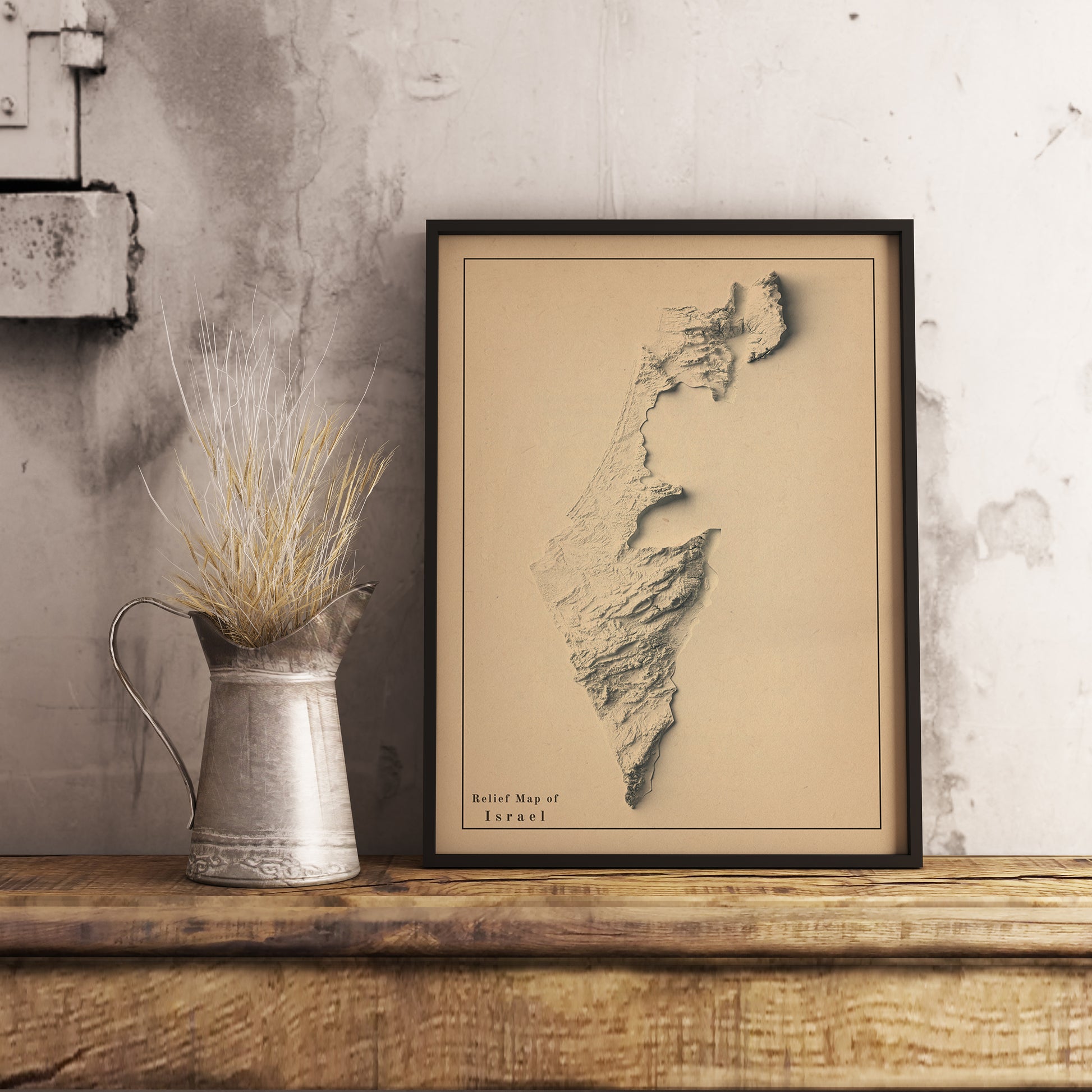 Vintage Israel shaded relief map in black frame. Realistic terrain art print for home decor, displayed on rustic wooden table
