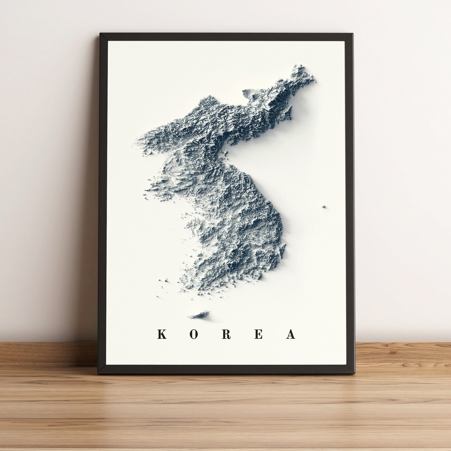 North & South Koreas framed shaded relief map in black frame. Artistic print highlighting mountains with a realistic terrain effect