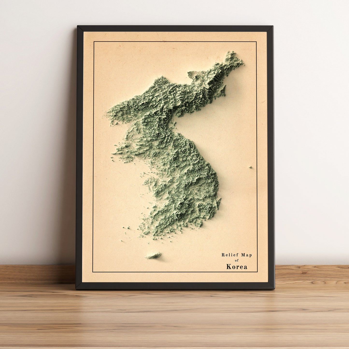 North & South Koreas vintage framed shaded relief map in black frame. Artistic print highlighting mountains with a realistic terrain effect