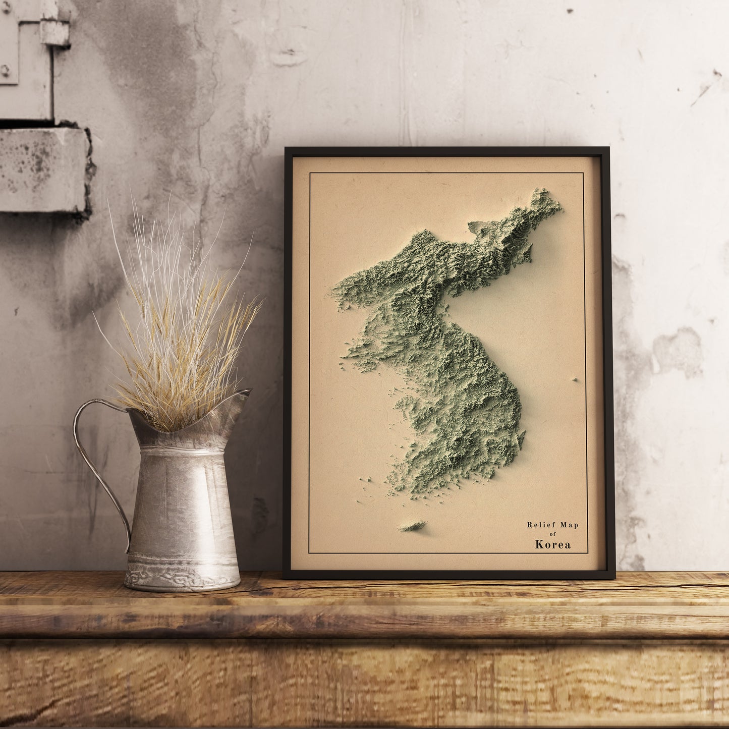 Vintage North and South Koreas shaded relief map in black frame. Realistic terrain art print for home decor, displayed on rustic wooden table