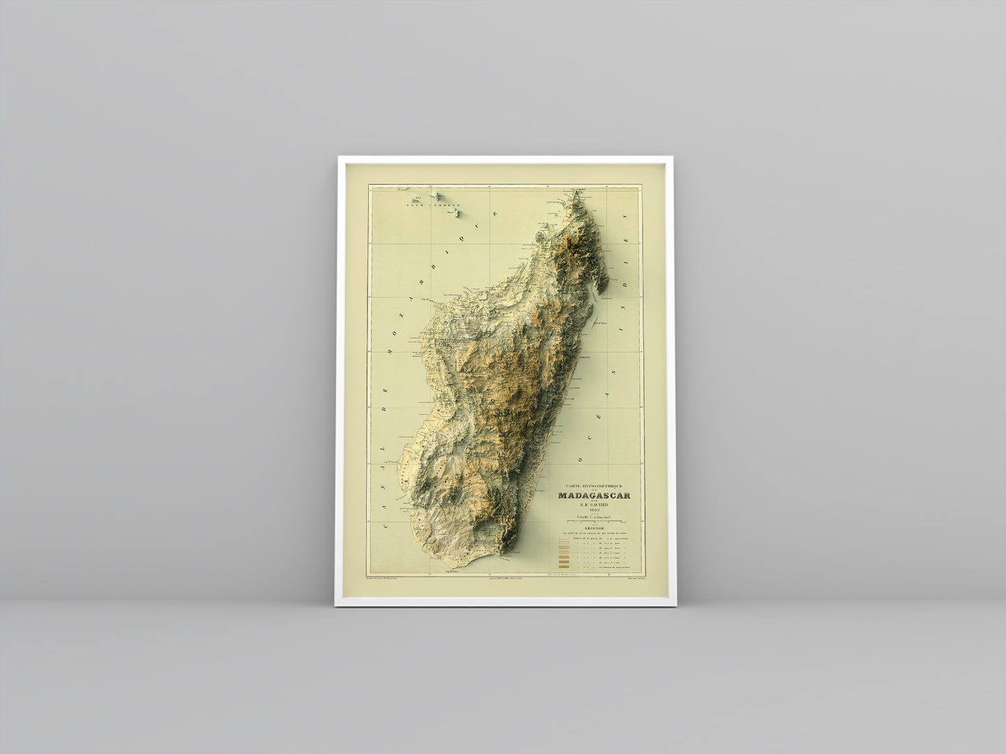 Madagascar vintage framed shaded relief map in white frame. Artistic print highlighting mountains with a realistic 3d effect