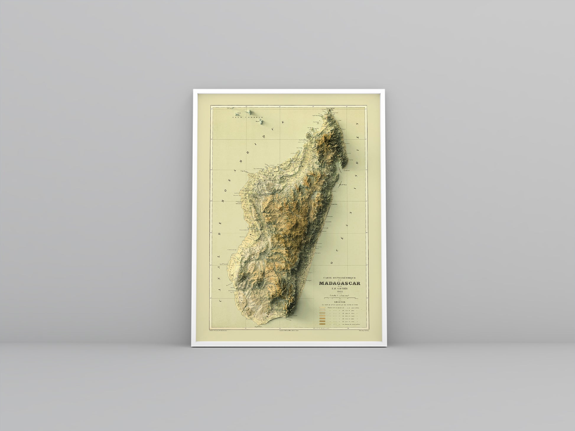 Madagascar vintage framed shaded relief map in white frame. Artistic print highlighting mountains with a realistic 3d effect