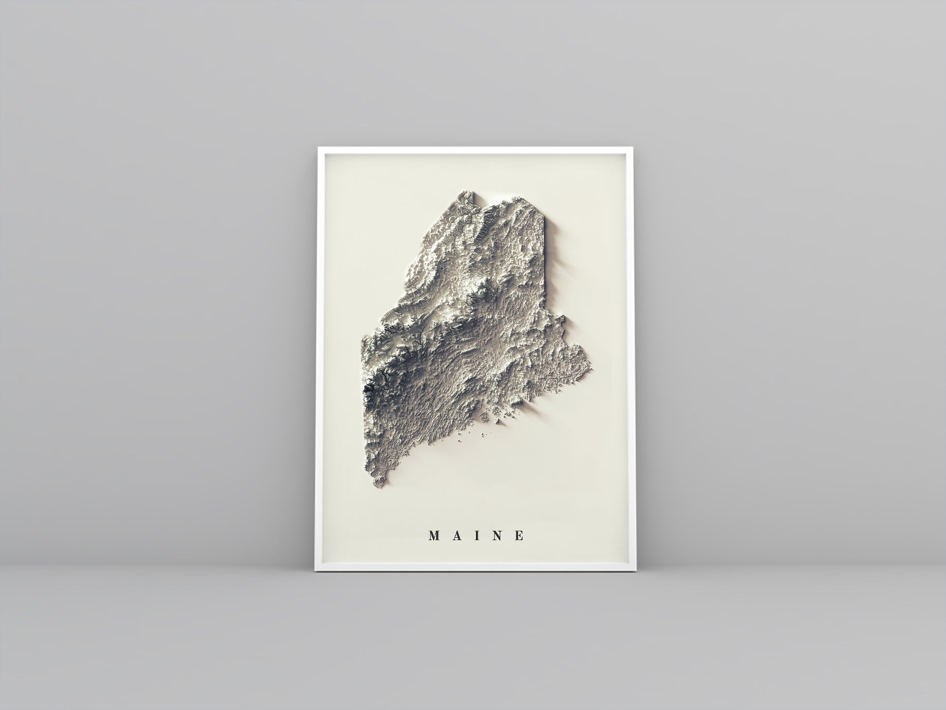 Maine (USA) framed shaded relief map in white frame. Artistic print highlighting mountains with a realistic 3d effect