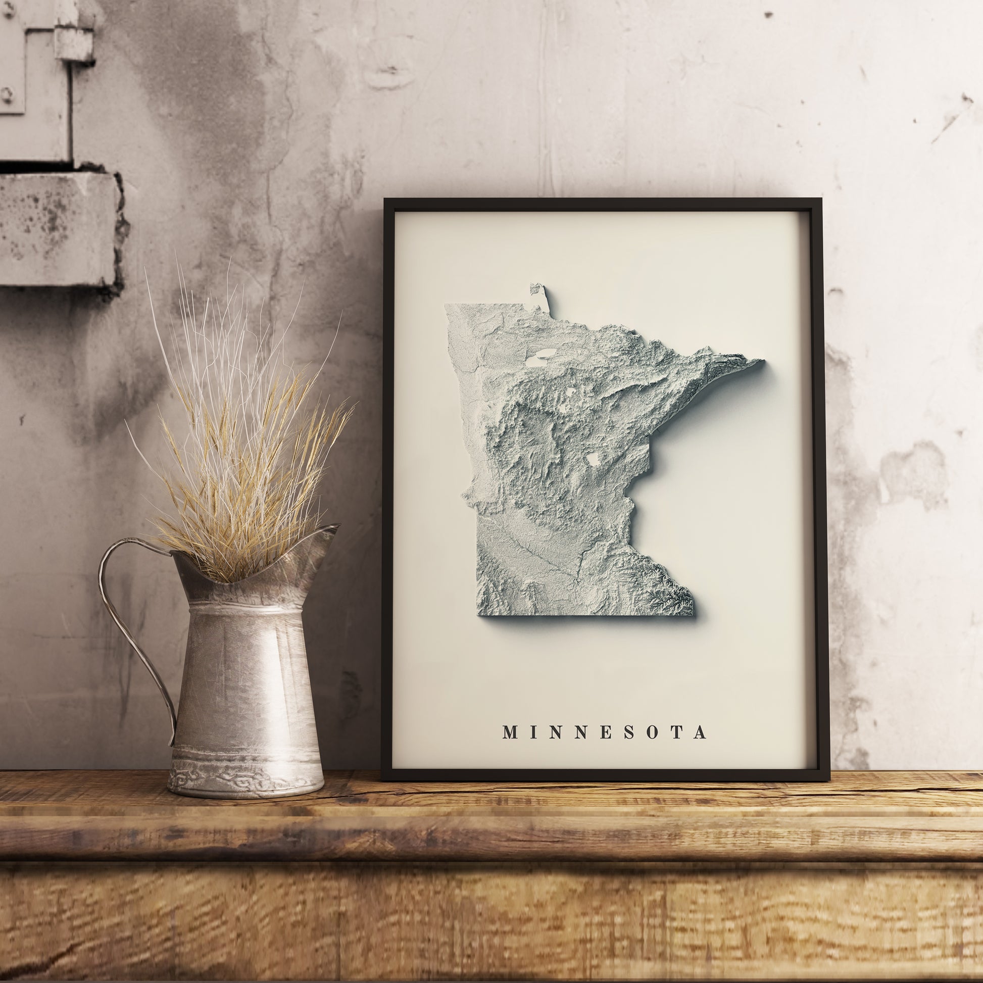 Minnesota (USA) shaded relief map in black frame. Realistic terrain art print for home decor, displayed on rustic wooden table