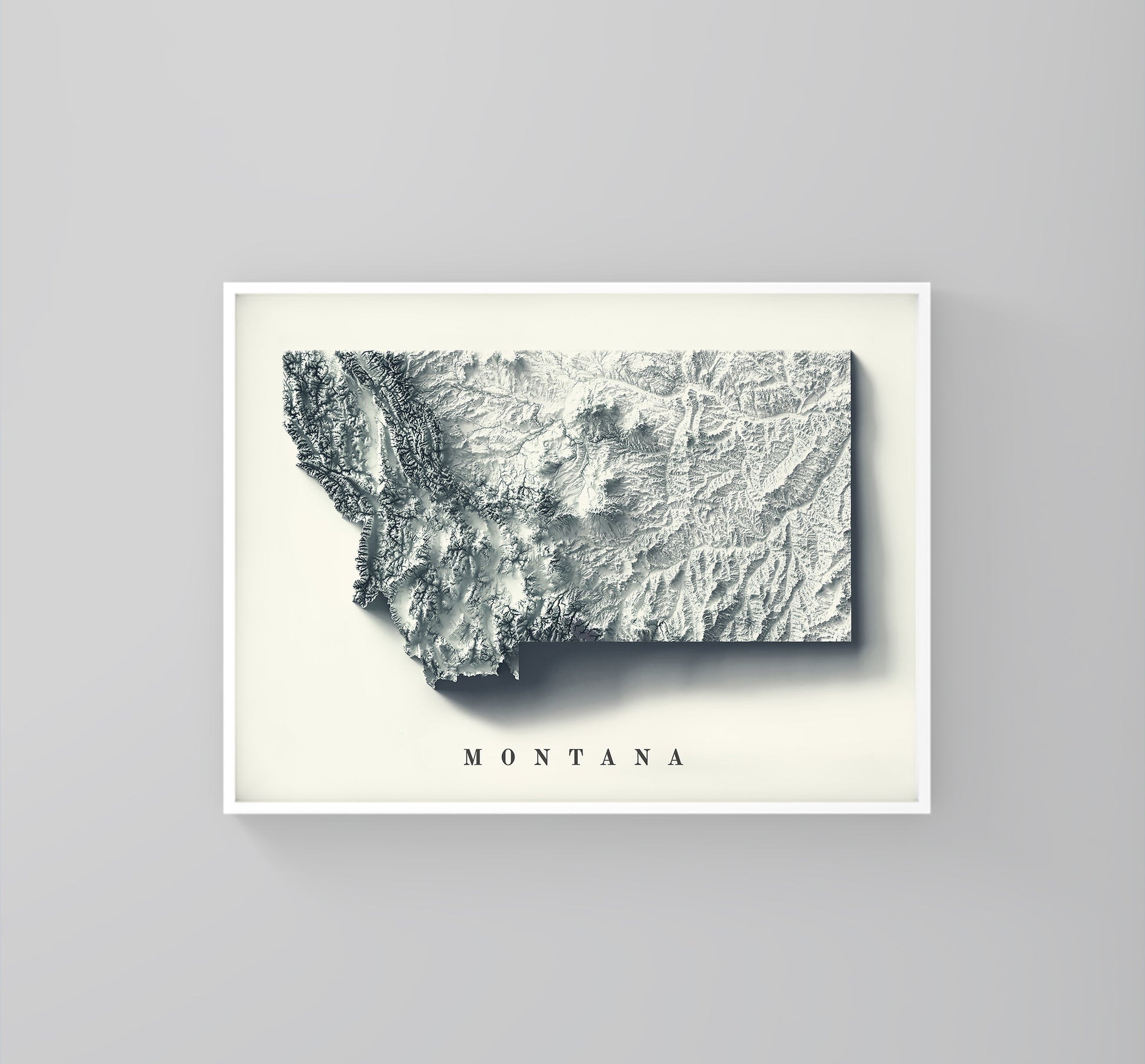 Montana (USA) framed shaded relief map in white frame. Artistic print highlighting mountains with a realistic 3d effect