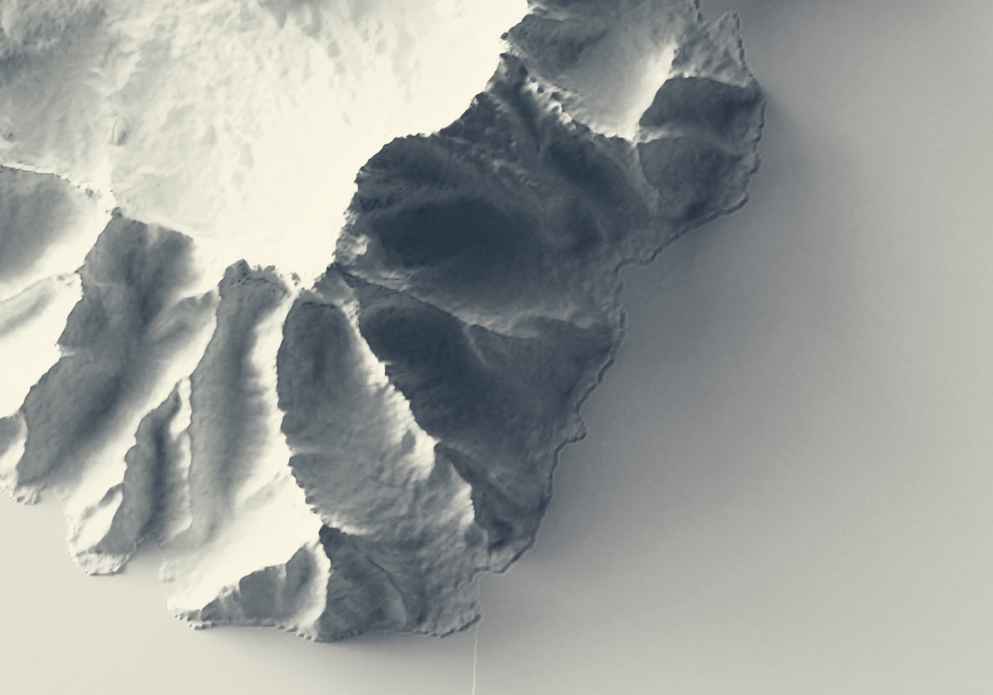 Detailed close-up of a Moorea (French Polynesia) relief map, showcasing textured topography and geographic contours