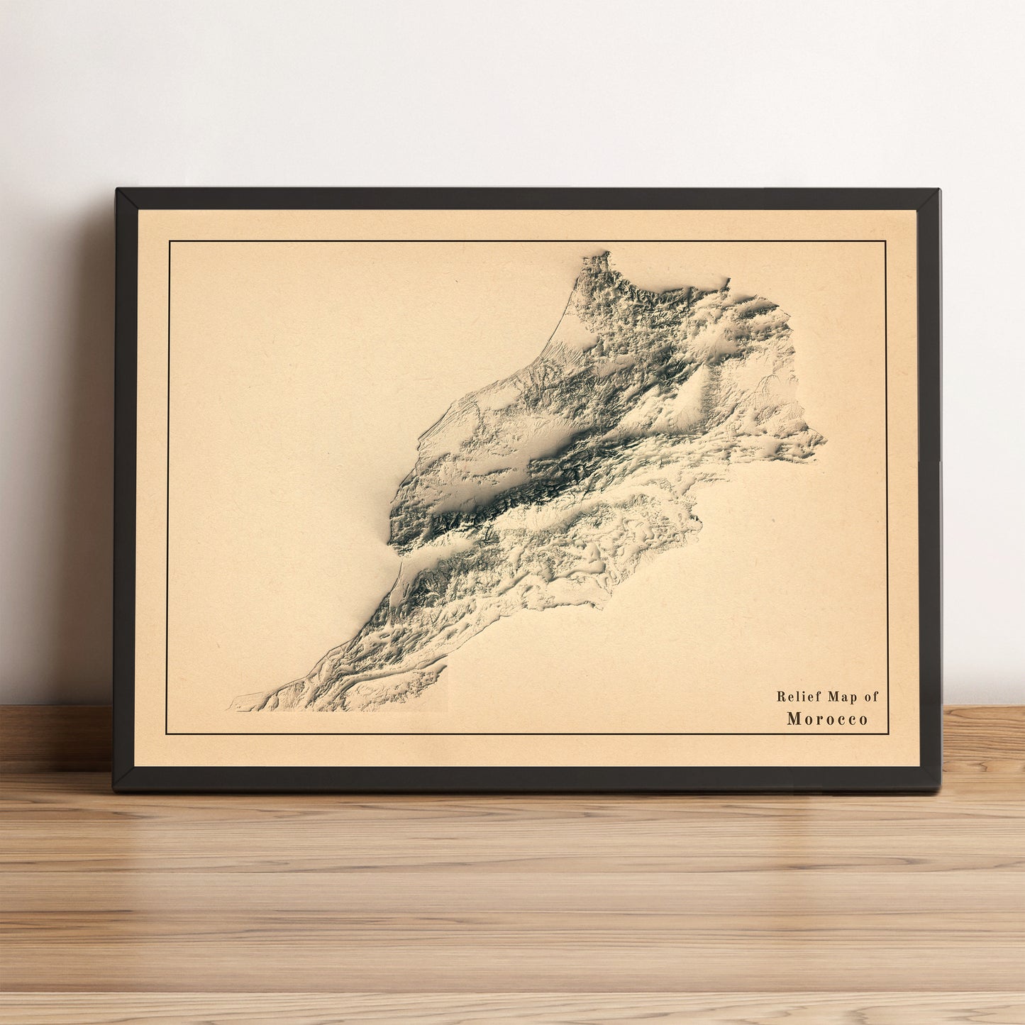 Morocco vintage framed shaded relief map in black frame. Artistic print highlighting mountains with a realistic terrain effect