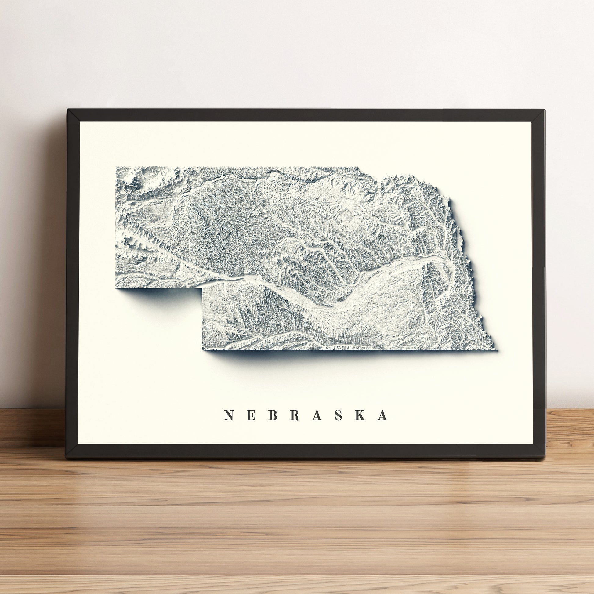 Nebraska (USA) framed shaded relief map in black frame. Artistic print highlighting mountains with a realistic terrain effect