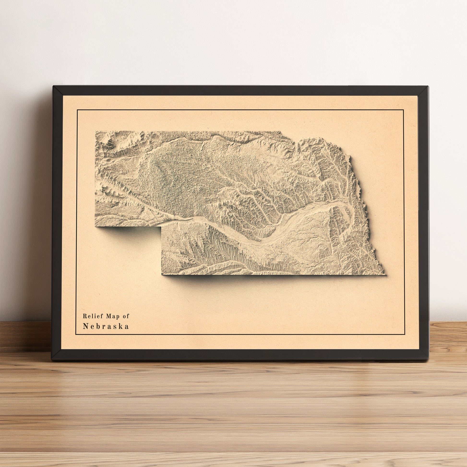 Nebraska (USA) vintage framed shaded relief map in black frame. Artistic print highlighting mountains with a realistic terrain effect