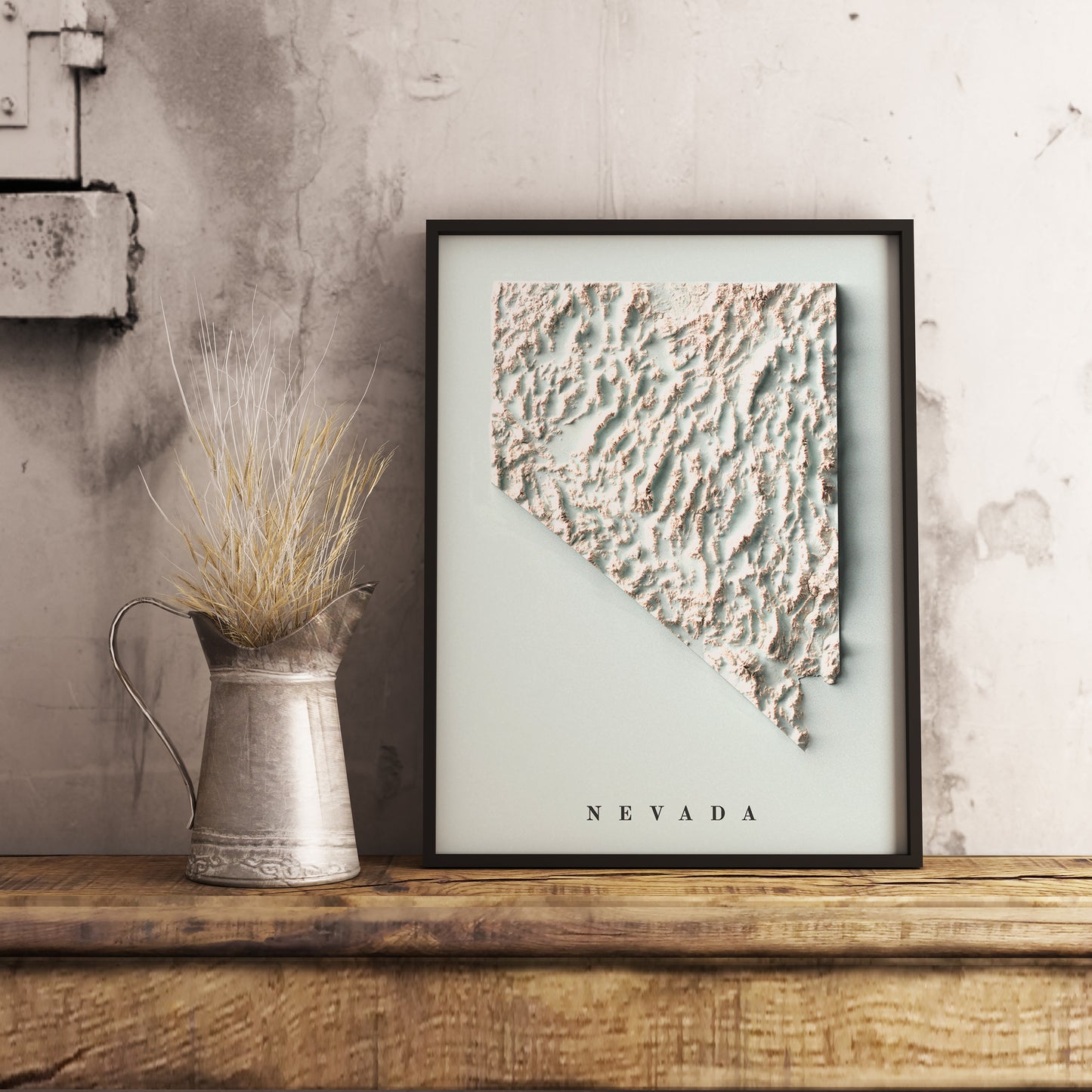 Nevada (USA) shaded relief map in black frame. Realistic terrain art print for home decor, displayed on rustic wooden table