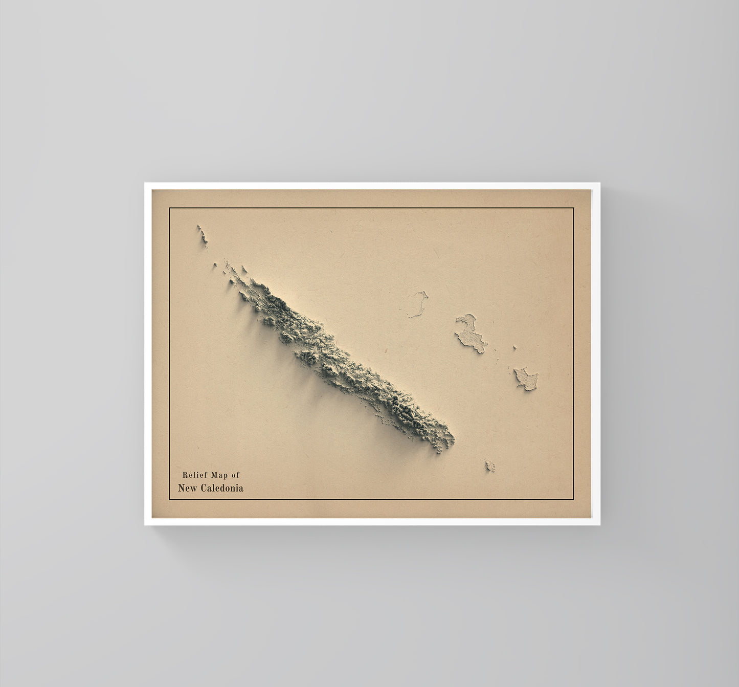 New Caledonia vintage framed shaded relief map in white frame. Artistic print highlighting mountains with a realistic 3d effect