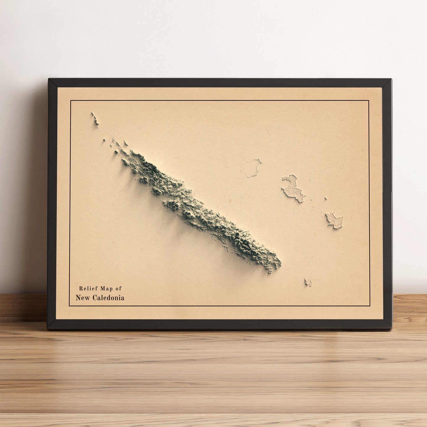New Caledonia vintage framed shaded relief map in black frame. Artistic print highlighting mountains with a realistic terrain effect