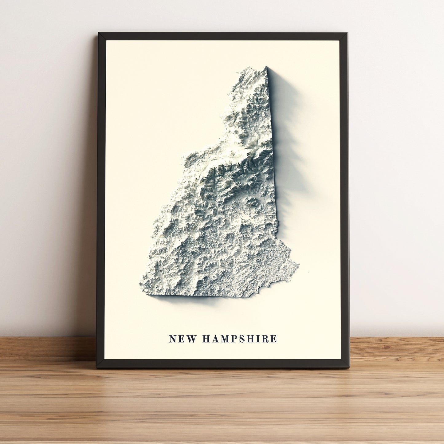 New Hampshire (USA) framed shaded relief map in black frame. Artistic print highlighting mountains with a realistic terrain effect