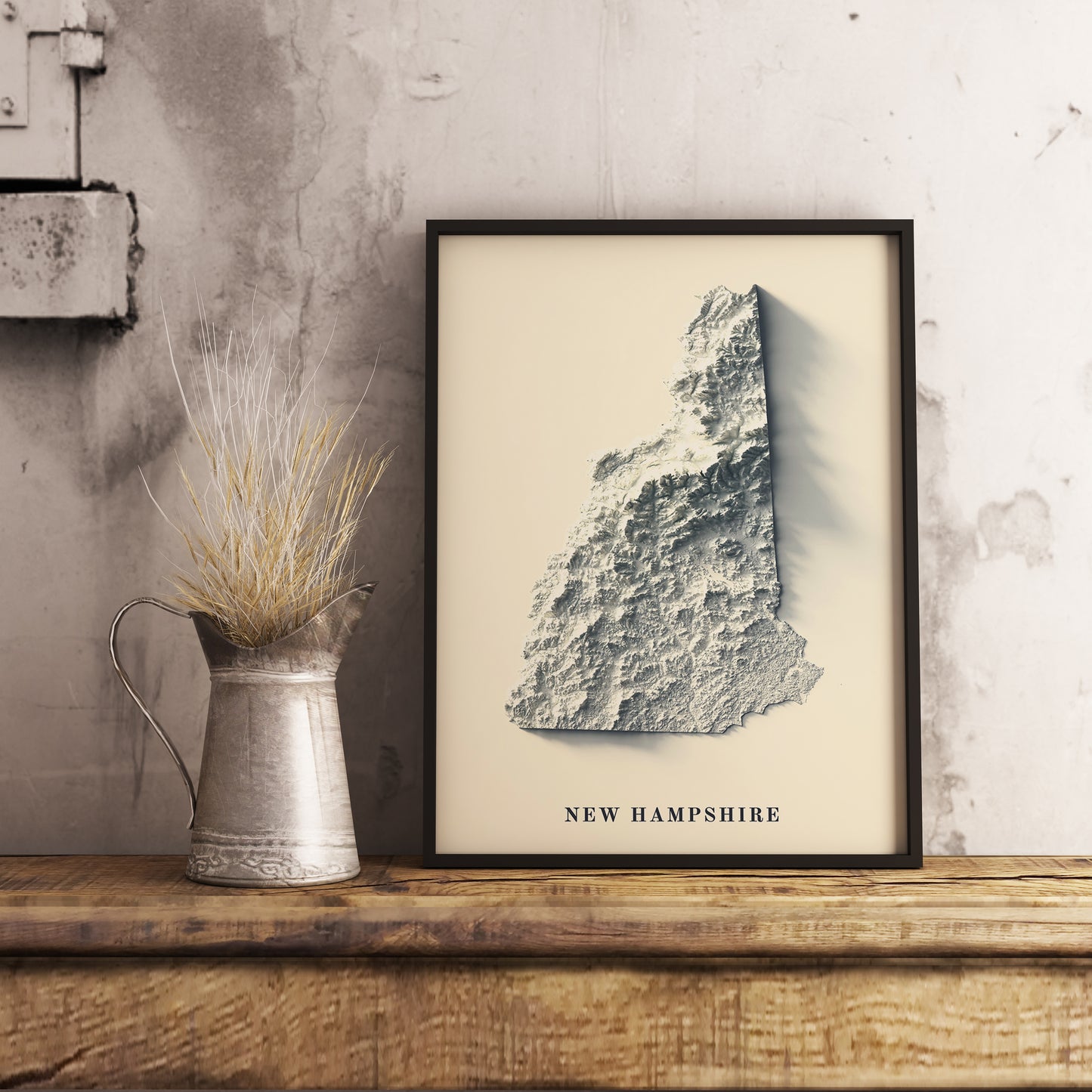 New Hampshire (USA) shaded relief map in black frame. Realistic terrain art print for home decor, displayed on rustic wooden table