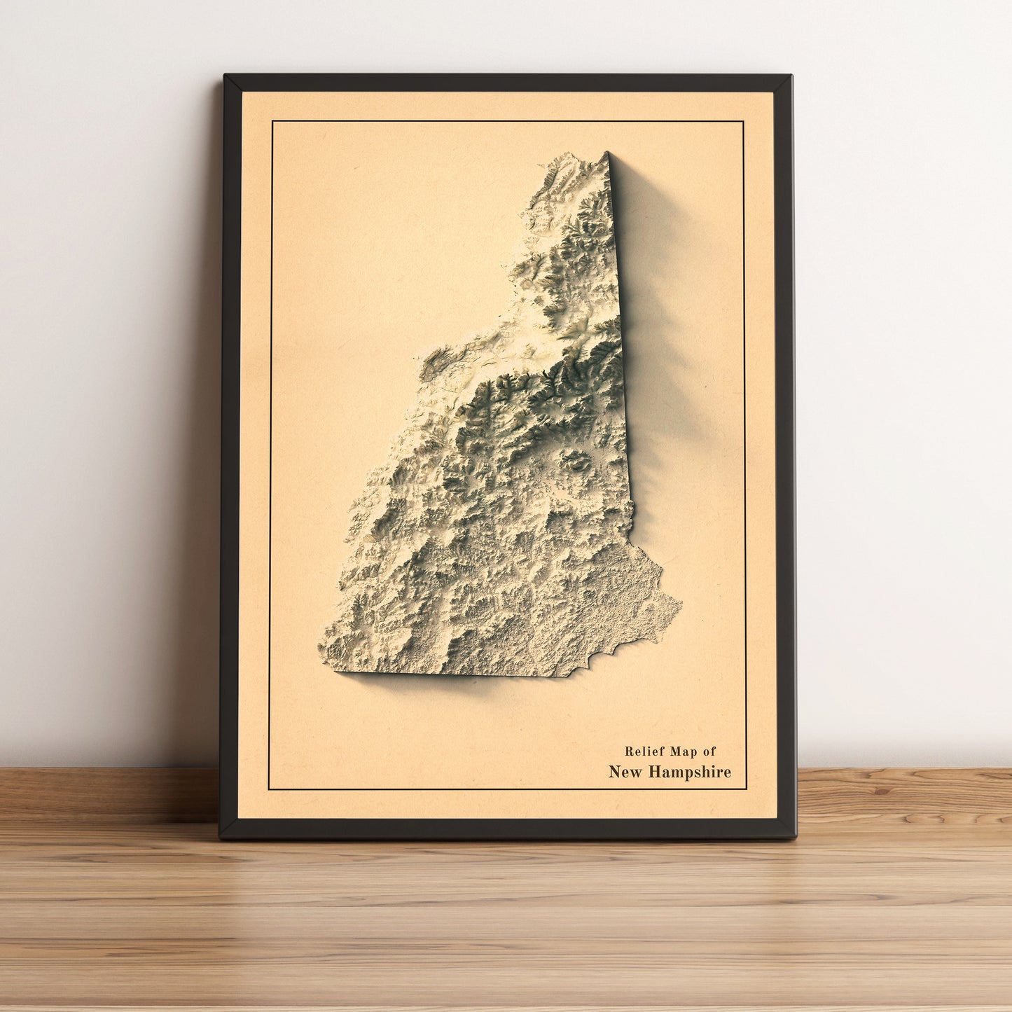 New Hampshire (USA) vintage framed shaded relief map in black frame. Artistic print highlighting mountains with a realistic terrain effect
