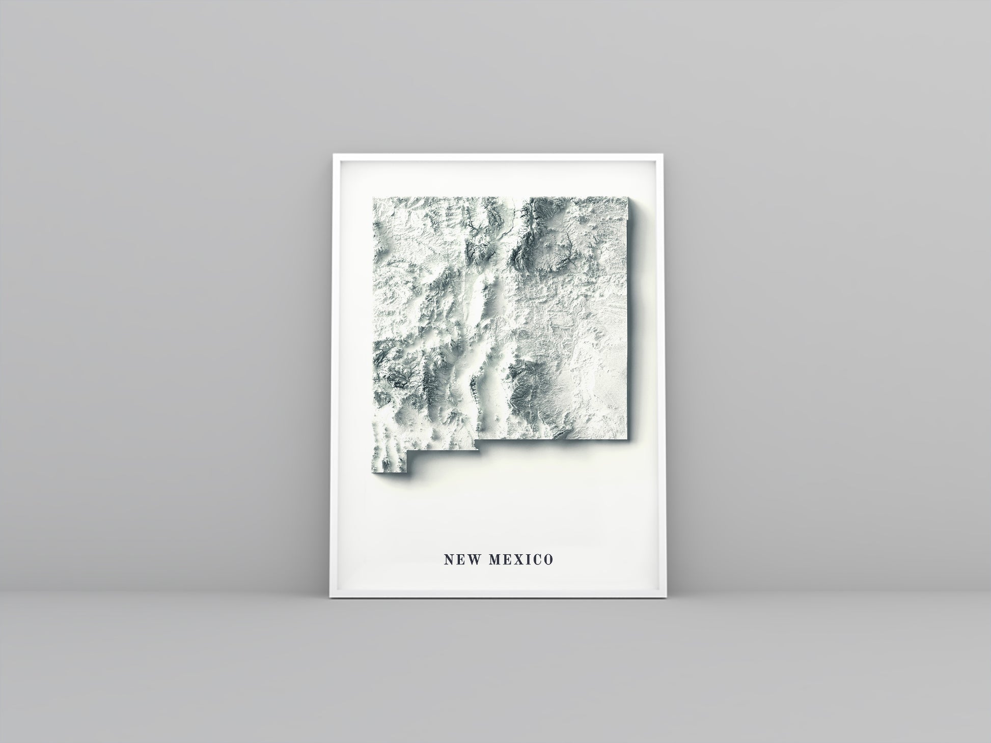 New Mexico (USA) framed shaded relief map in white frame. Artistic print highlighting mountains with a realistic 3d effect