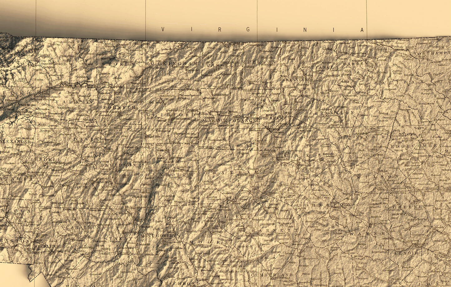 Detailed close-up of a vintage North Carolina (USA) relief map, showcasing textured topography and geographic contours